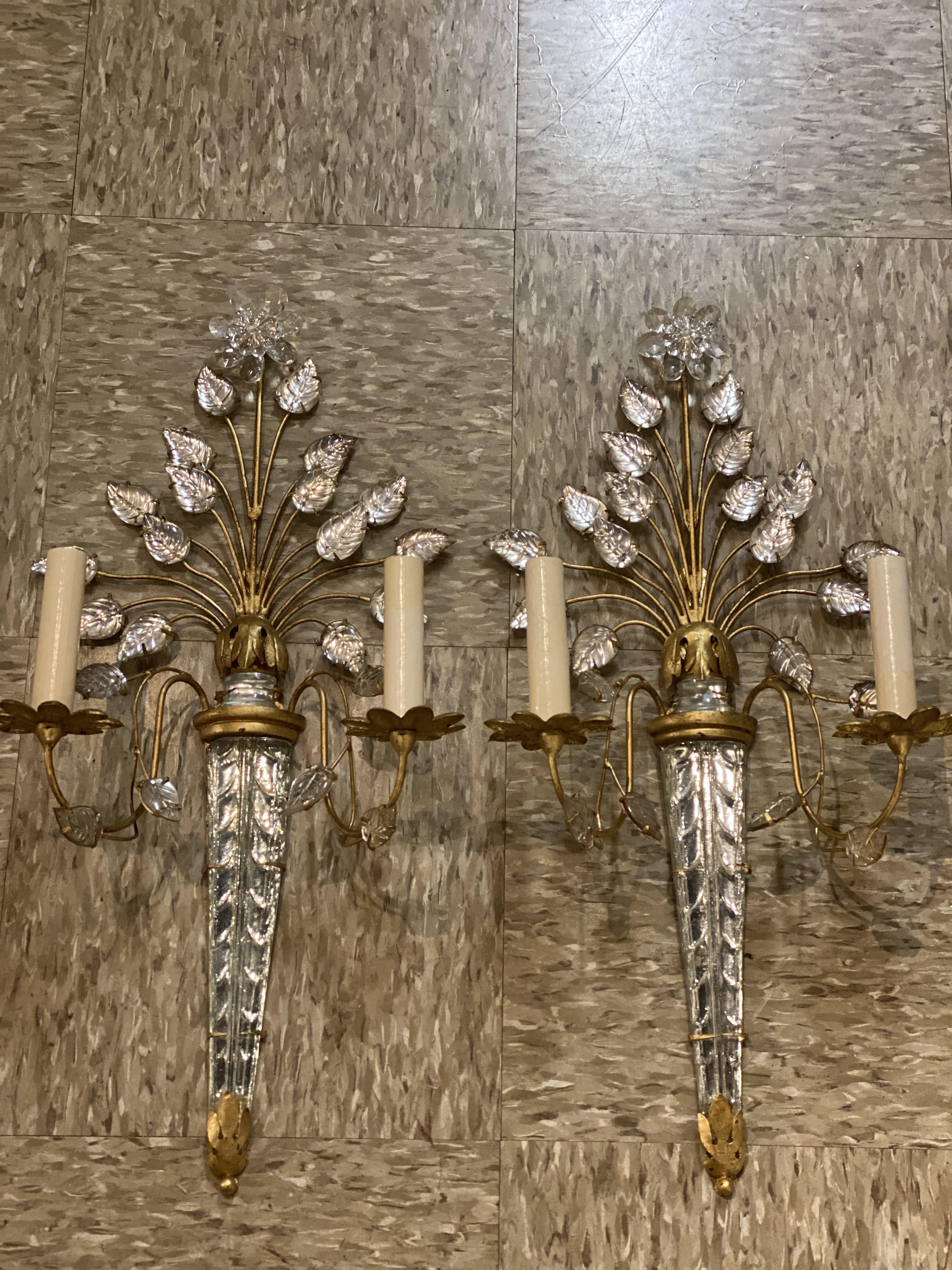 A pair of circa 1930's French Bagues sconces with glass leaves design.