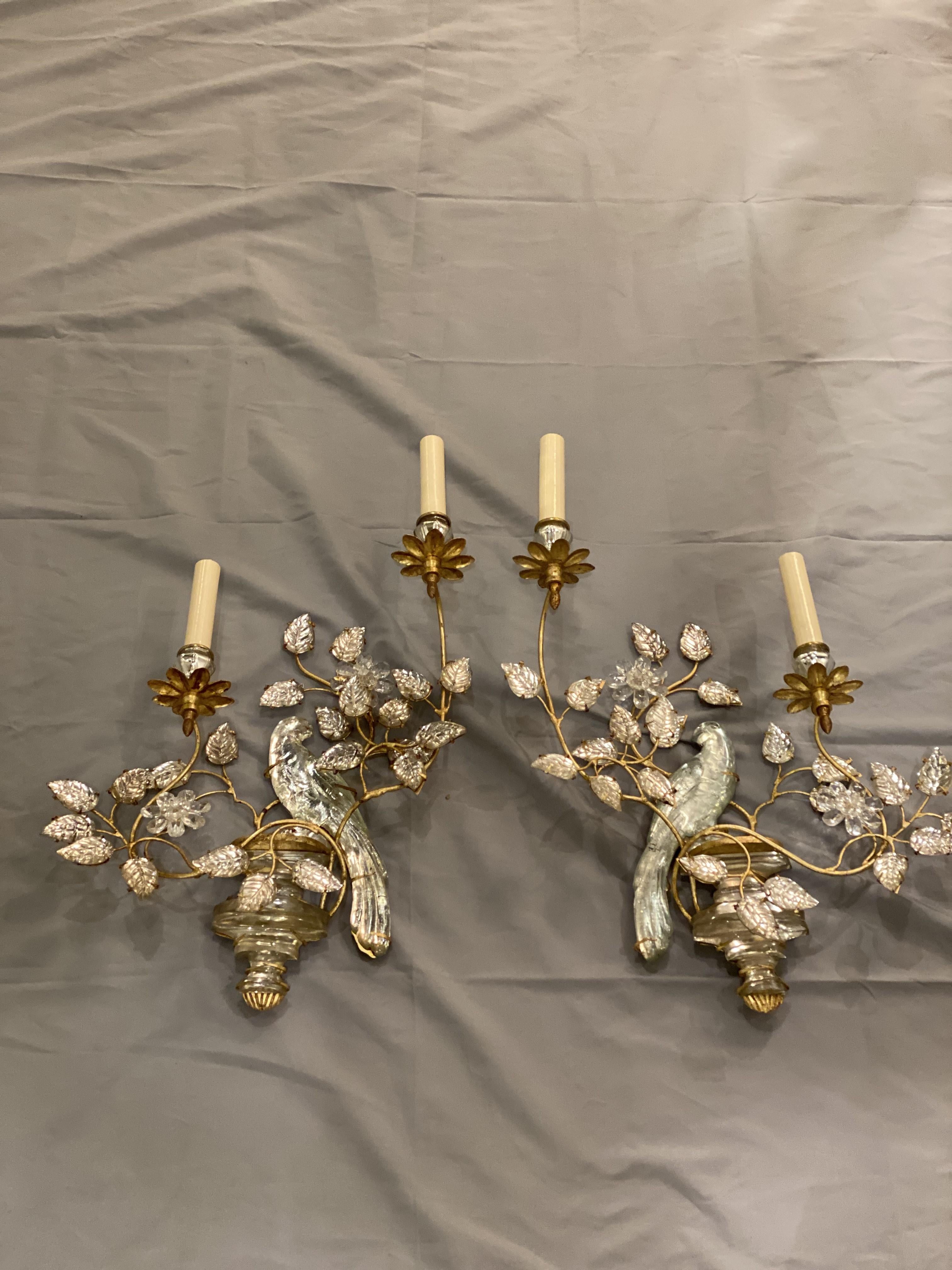 a pair of circa 1930's French Bagues sconces with bird's design and glass leaves