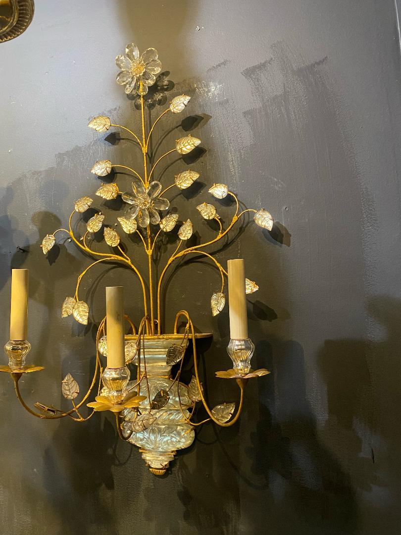 A pair of circa 1930's French gilt metal 3 lights sconces with glass leaves.