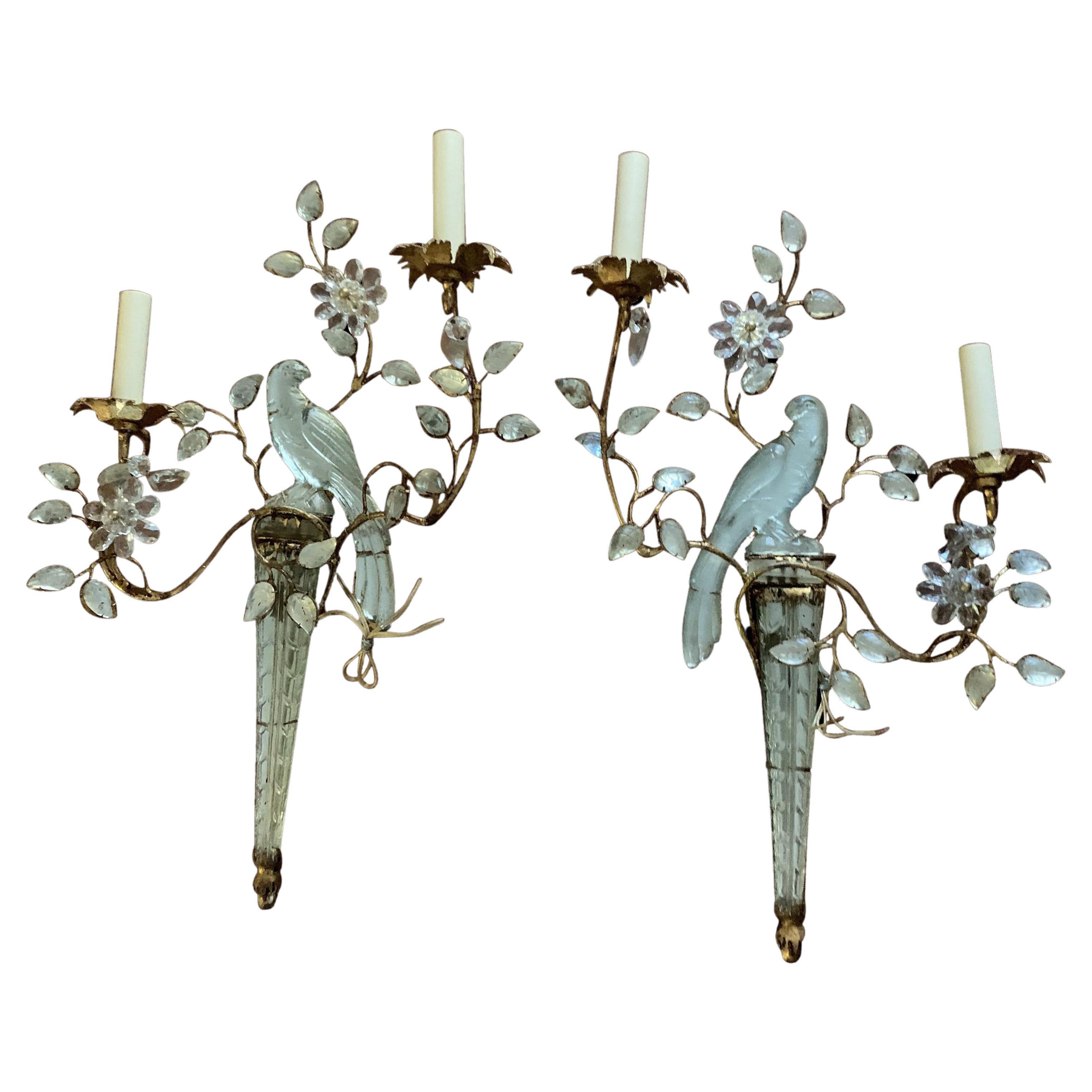 A pair of circa 1930's gilt metal sconces with glass bird's design and glass leaves