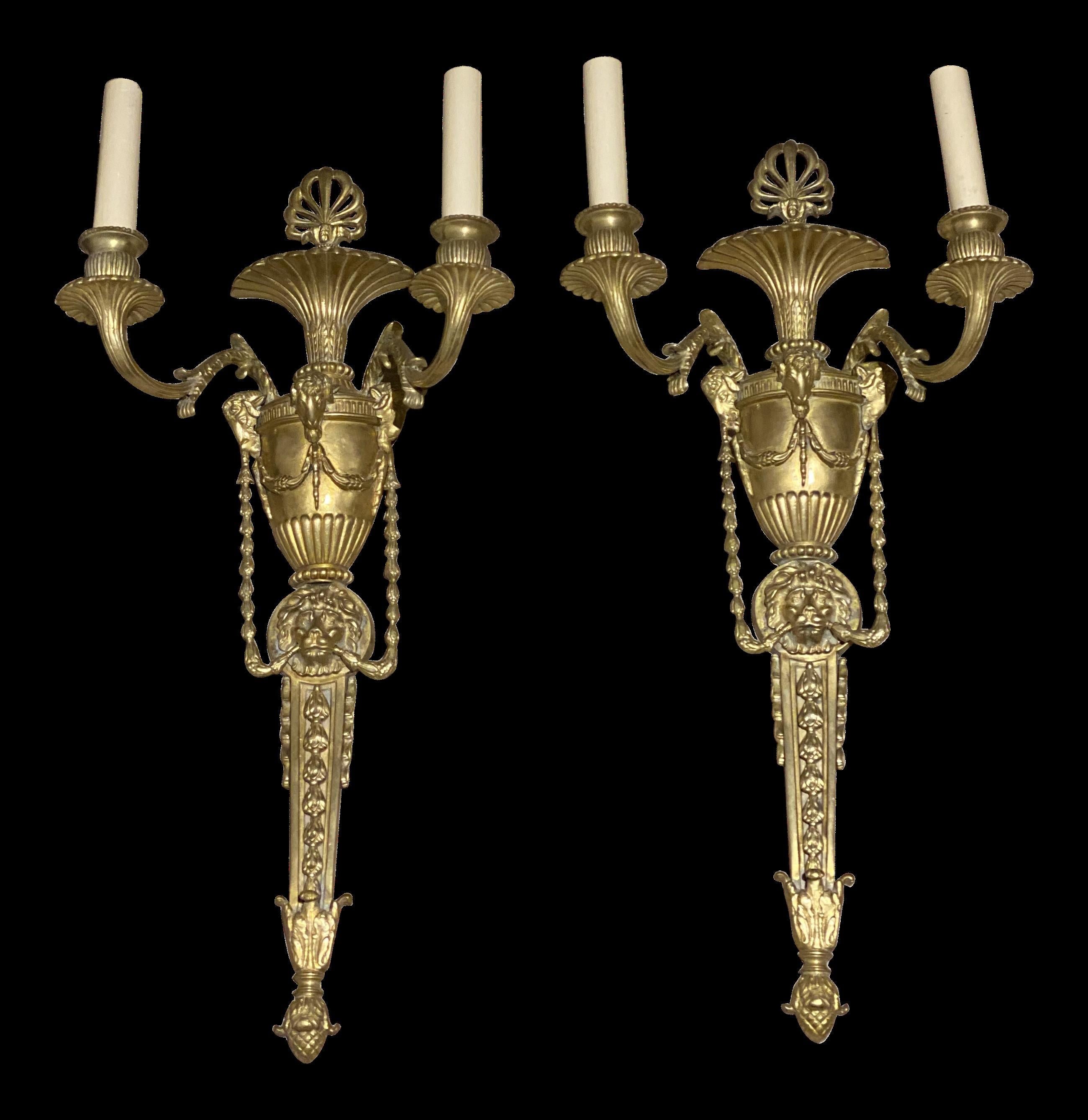 A pair of circa 1930's French Empire style gilt bronze sconces with Ram's heads.