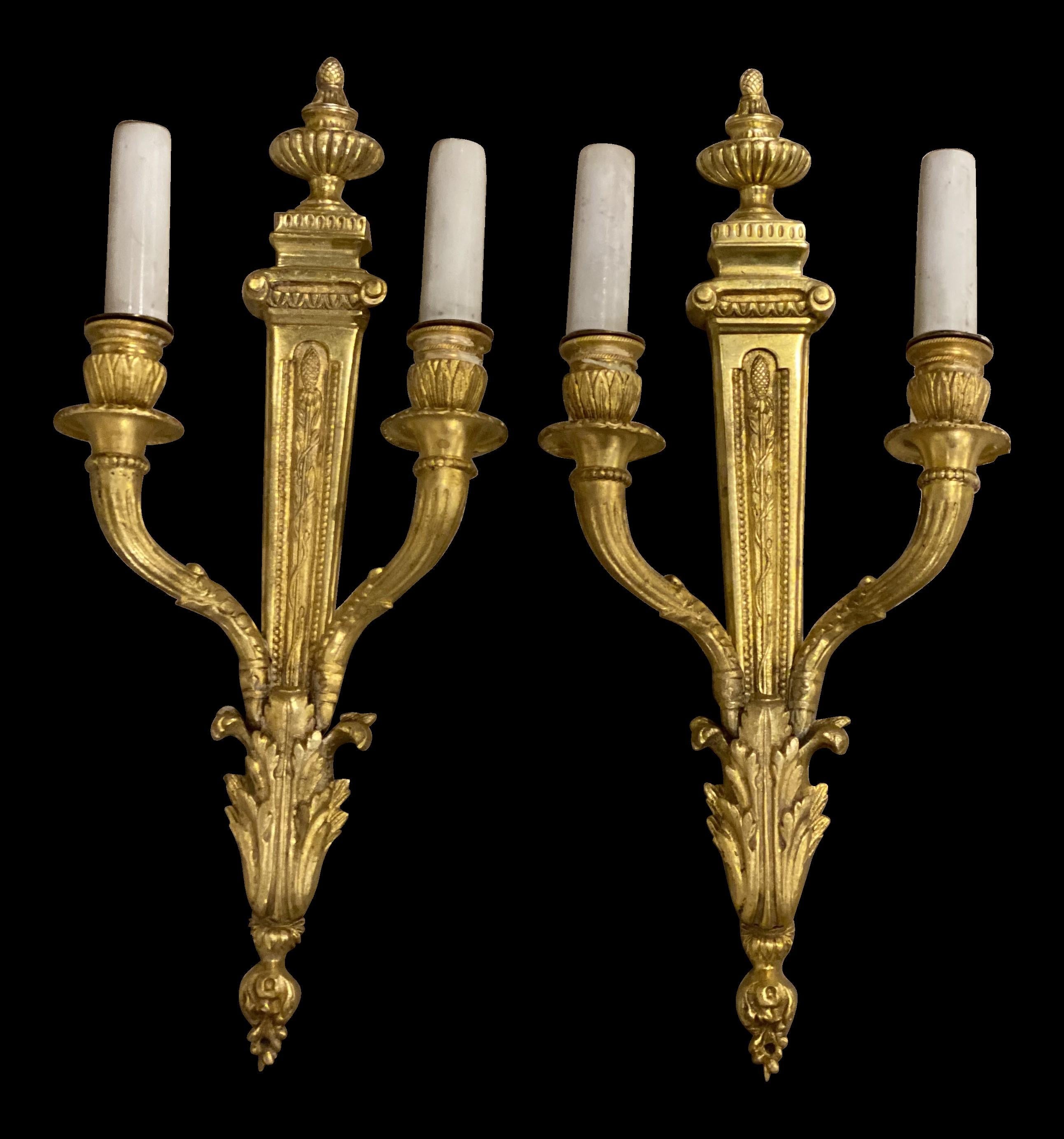 A pair of circa 1930's French gilt bronze double light sconces in style of Louis XVI