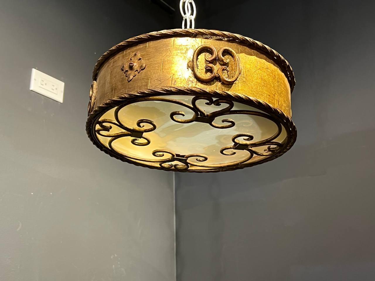 A circa 1930's French gilt metal light fixtures with frosted glass inset
