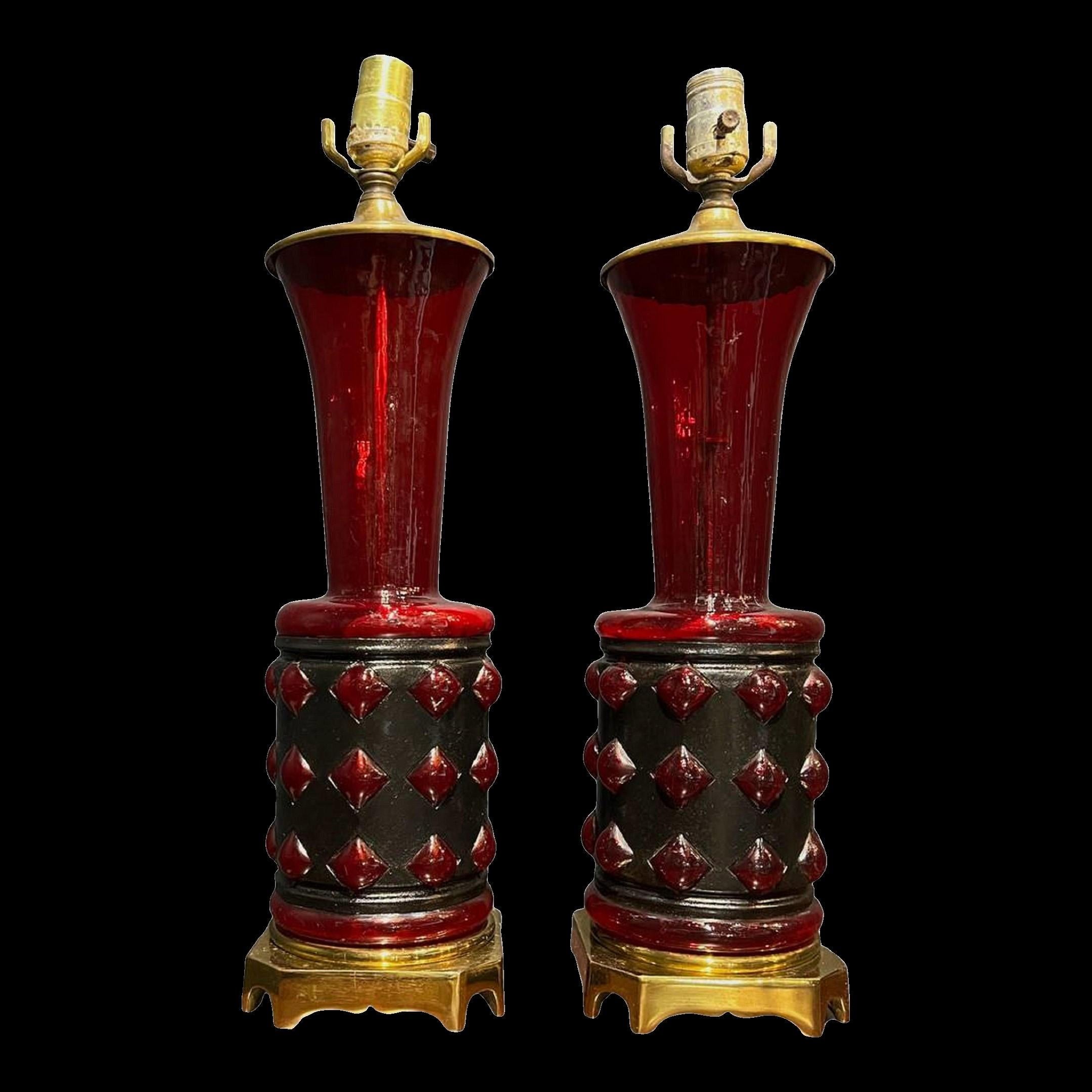 A pair of circa 1930's French blown glass in metal frame table lamps, unusual ruby colored glass