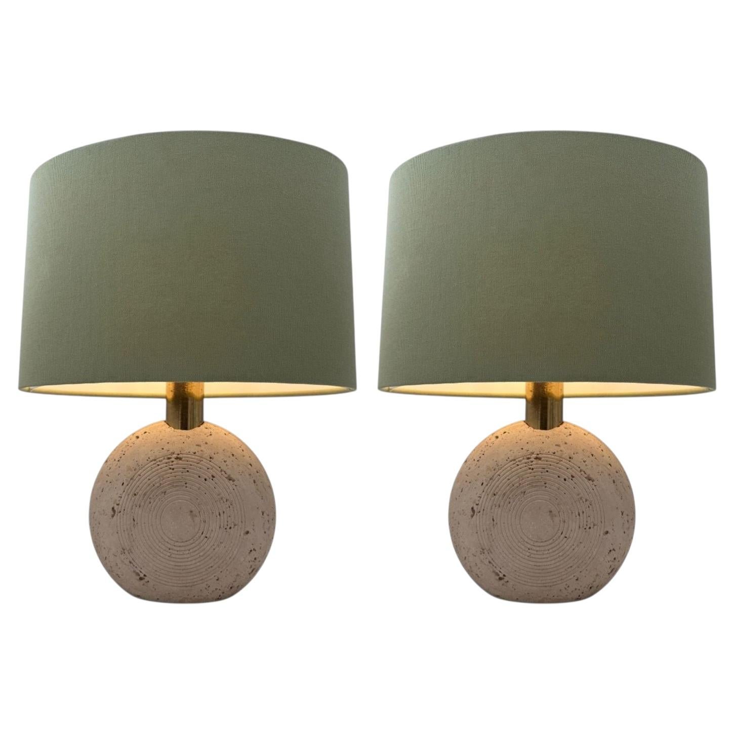 A pair of circular Italian 1970s travertine and brass lamps by Fratelli Manelli