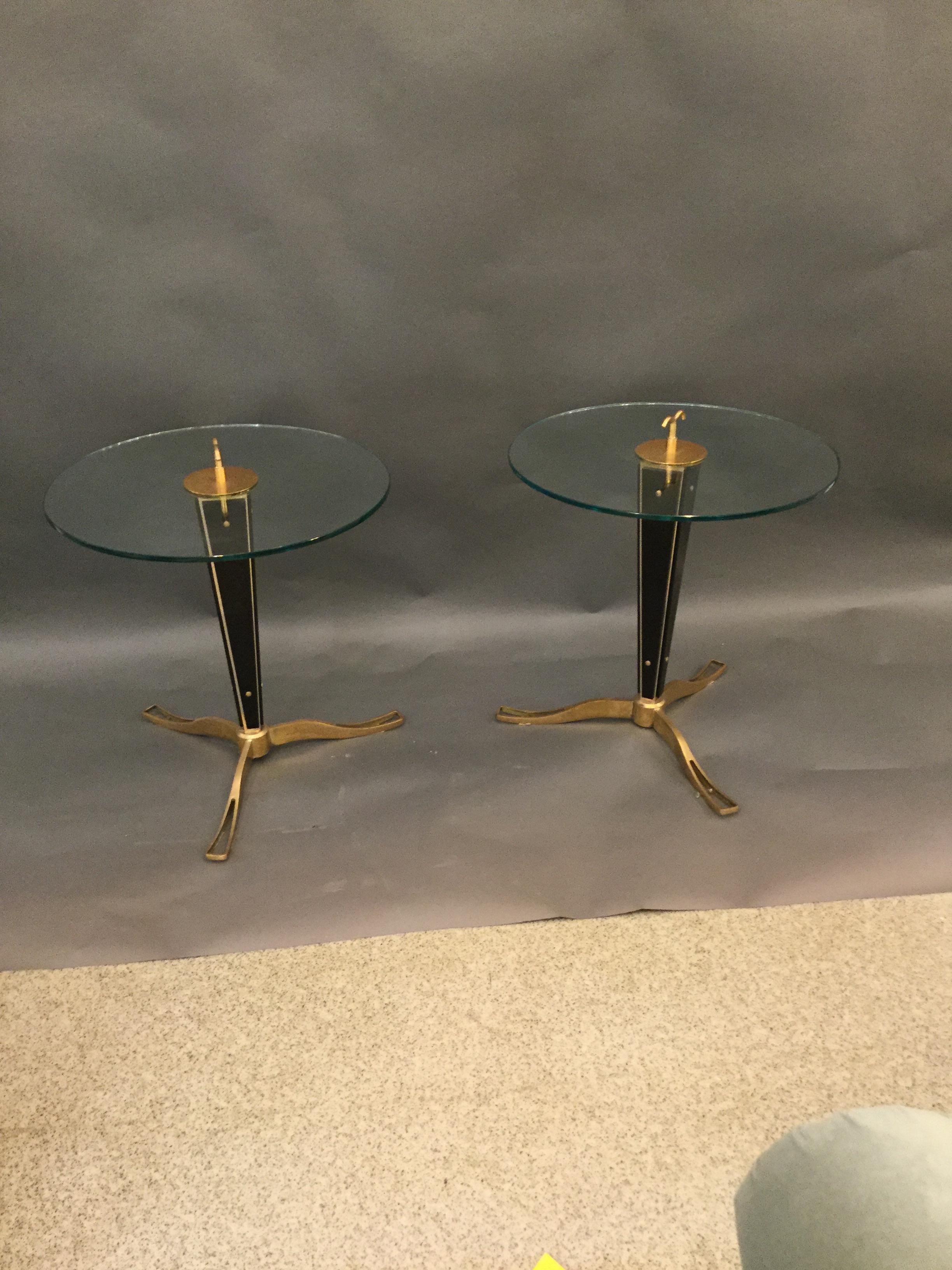 A stunning pair of Italian designed cocktail tables in bronze and glass on tripod legs with glass top the with glass on the base, 1960.