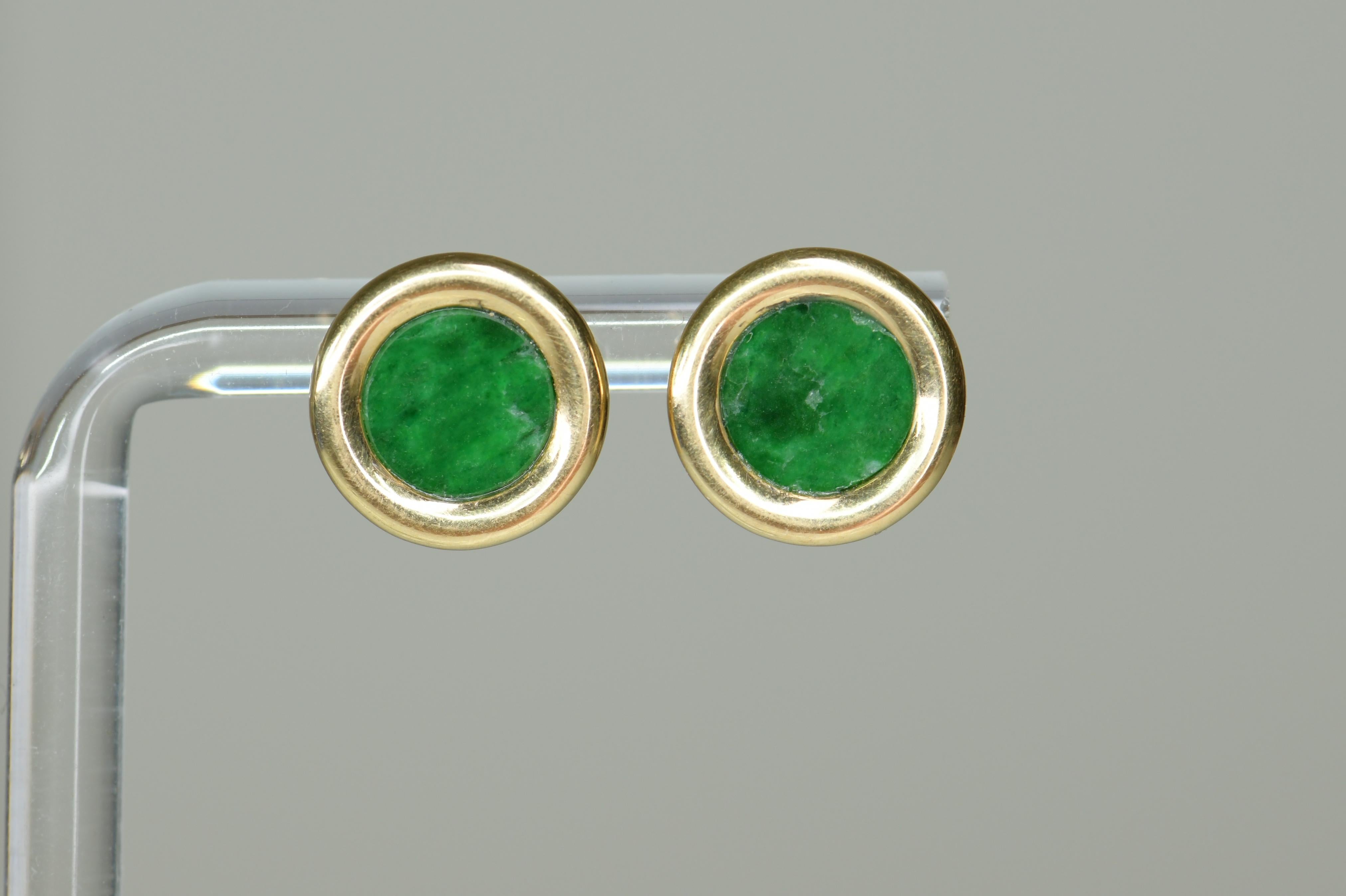 This lovely pair of elegant earrings are crafted from 18k yellow gold, it has a natural no treatment green jadeite.

Diameter: 0.5 inch 
Weight: 5.8g

We have many other fantastic pieces of antique and vintage jewelry listed on our 1stdibs store, so
