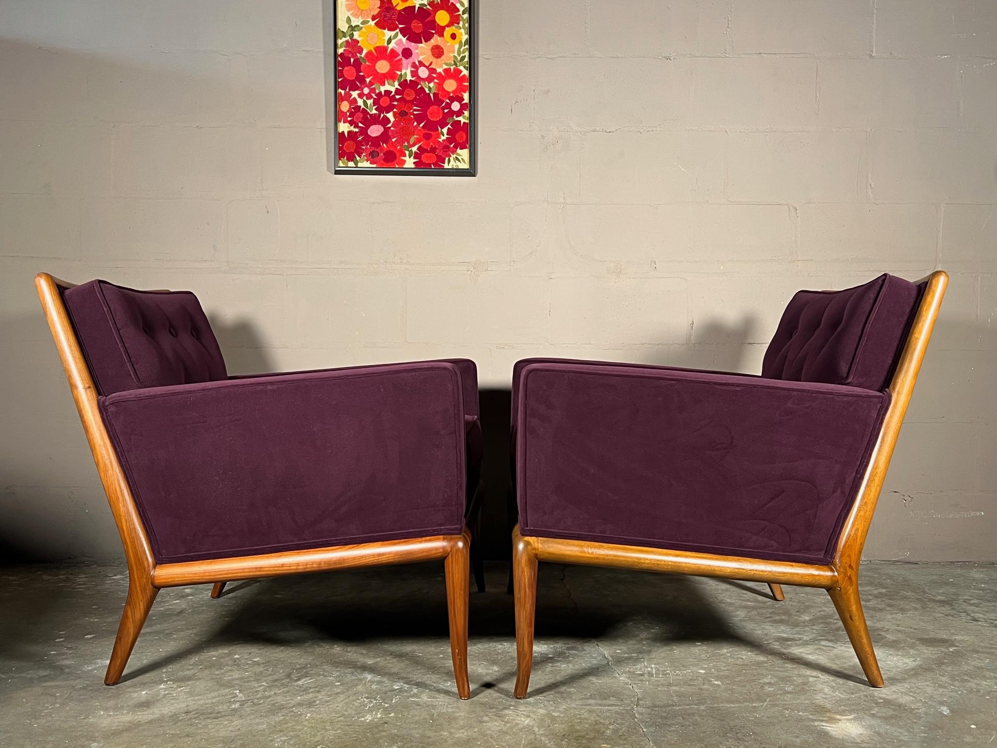 A pair of classic armchairs by T.H.Robsjohn-Gibbings fro Widdicomb, ca' 1950's. Open walnut frames, reupholstered.