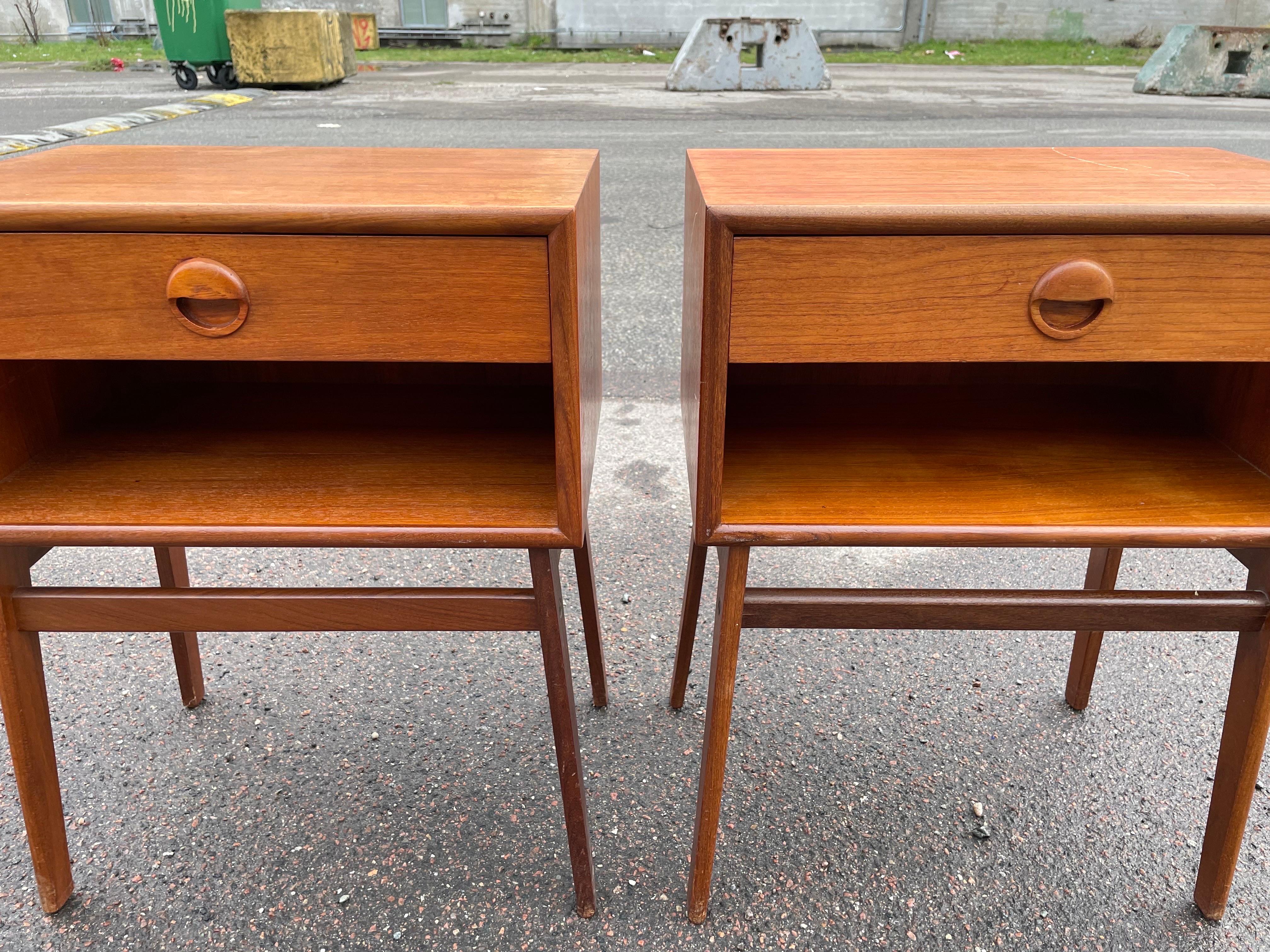 Danish Mid-Century Modern Nightstands, a perfect blend of elegance and functionality. Crafted in teak, these pieces feature sleek lines and are embodying the timeless appeal of mid-century design. The minimalist yet stylish drawer handles add a