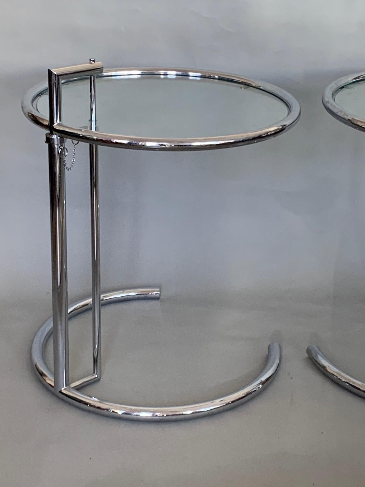 A pair of iconic tables designed by Eileen Gray, circa 1920s. The tops adjust from approximate 22