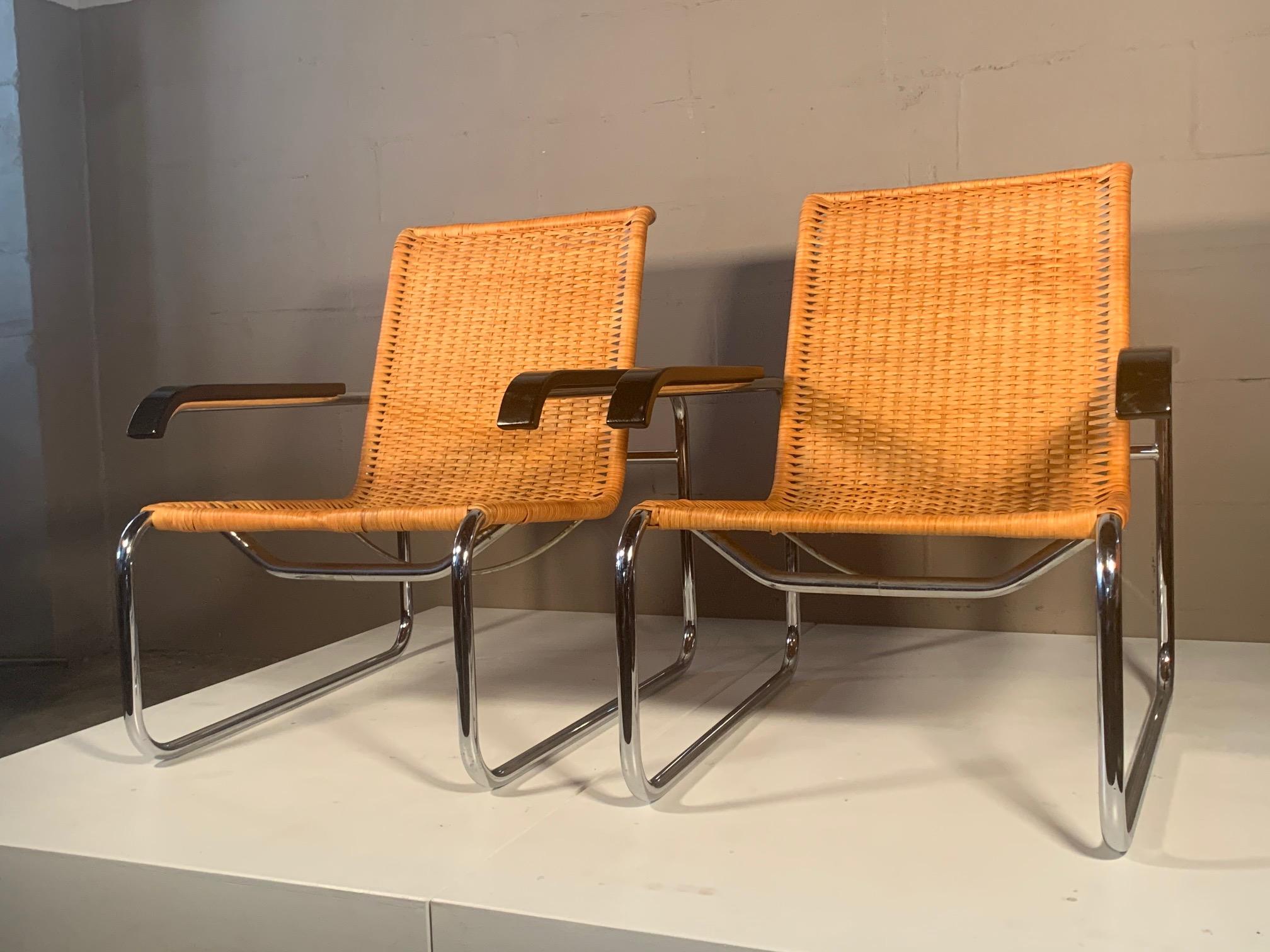 A beautiful pair of chrome and cane Marcel Breuer vintage armchairs. Made in West Germany, circa 1970s and distributed by ICF. Classic chairs that are comfortable and look good from every angle.