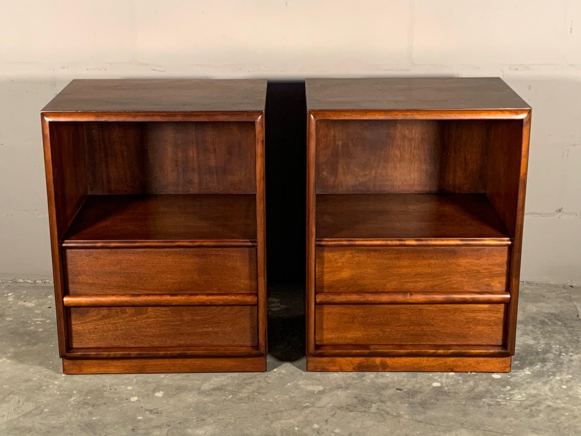 A pair of Classic boxlike nightstands by T.H. Robsjohn-Gibbings for Widdicomb, circa 1950s. Restored in an old fashioned way-custom hand rubbed finish, allowing the patina to come through clearly and beautifully.