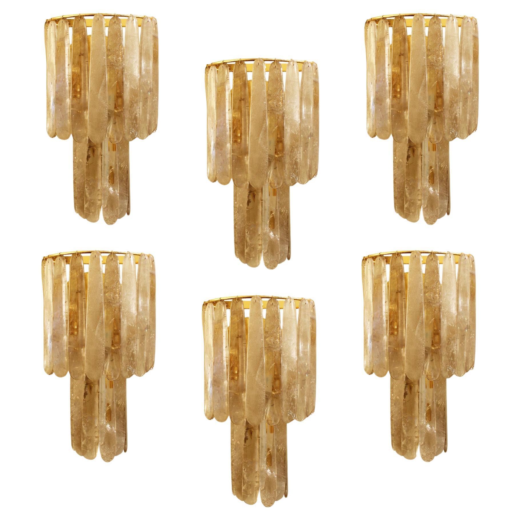 A pair of classic two tier rock crystal wall lights