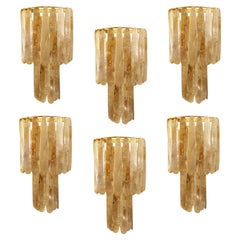 A pair of classic two tier rock crystal wall lights