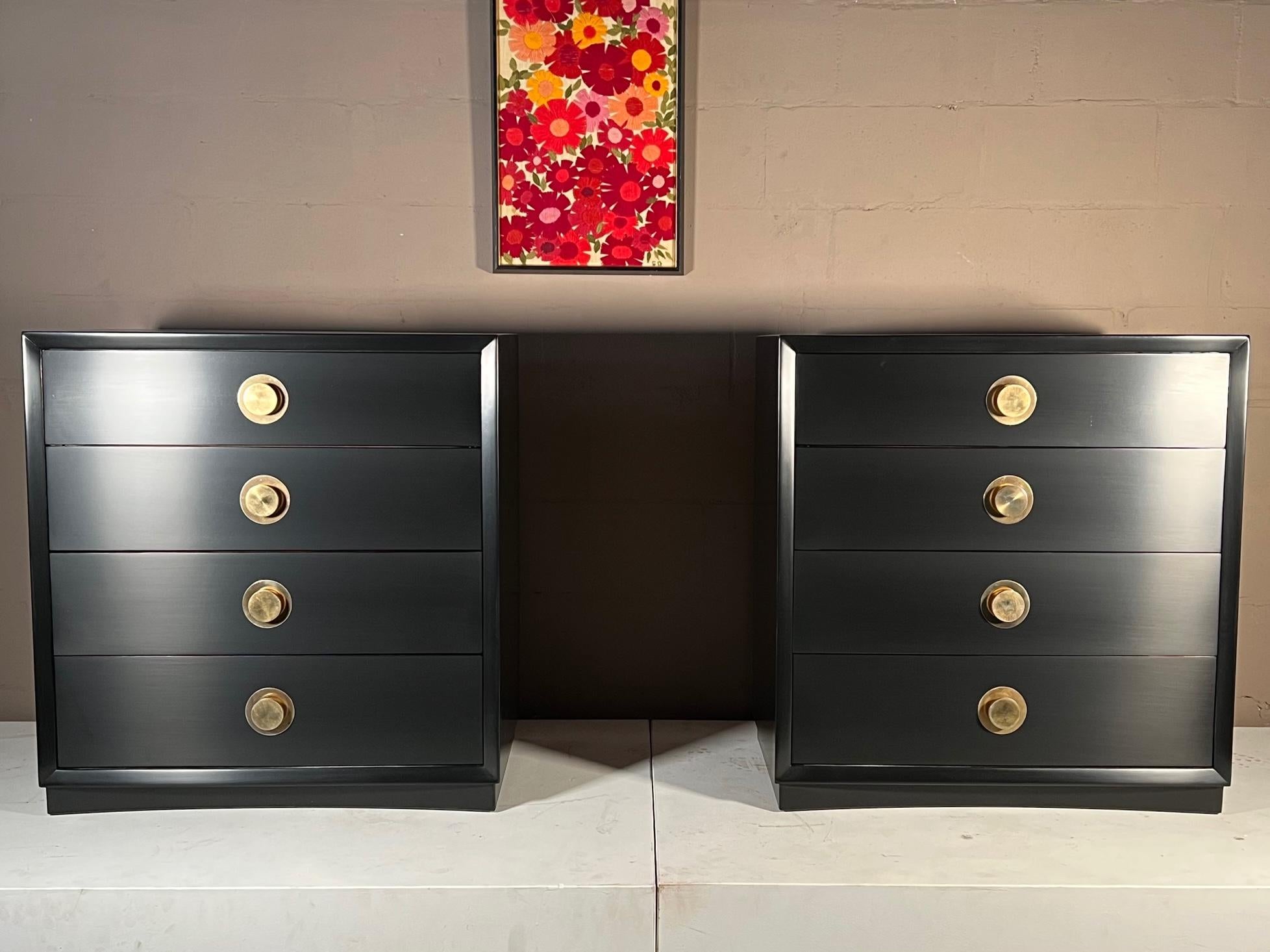A pair of elegant four drawer dressers with solid brass hardware. Picture frame design with curved platform, these are very heavy and well made. Freshly redone in black laquer with hand rubbed satin finish. Nice scale -could be used large night