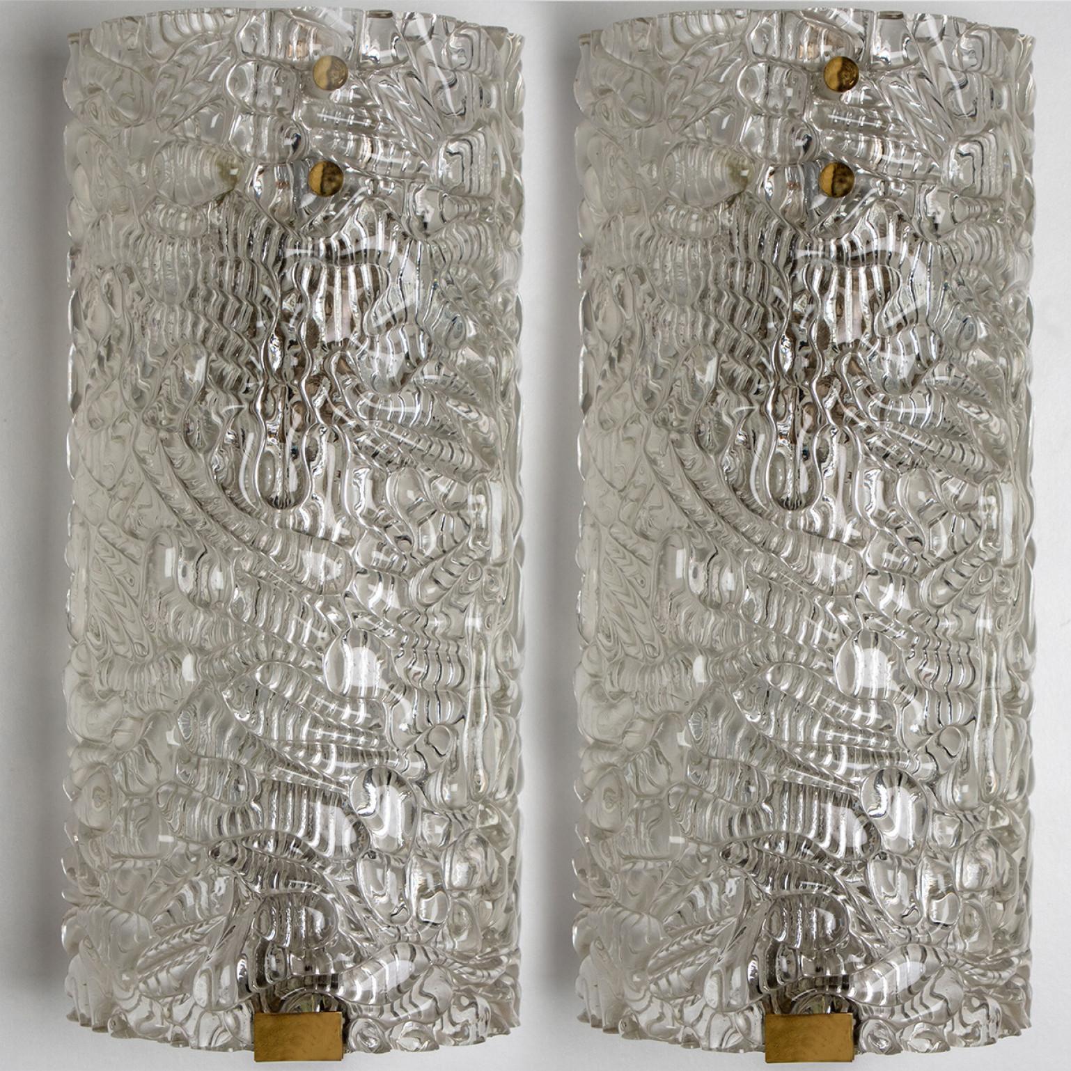 Mid-Century Modern A pair of Clear Bubbled Glass Wall Light Fixtures by Hillebrand, Germany, 1960s For Sale