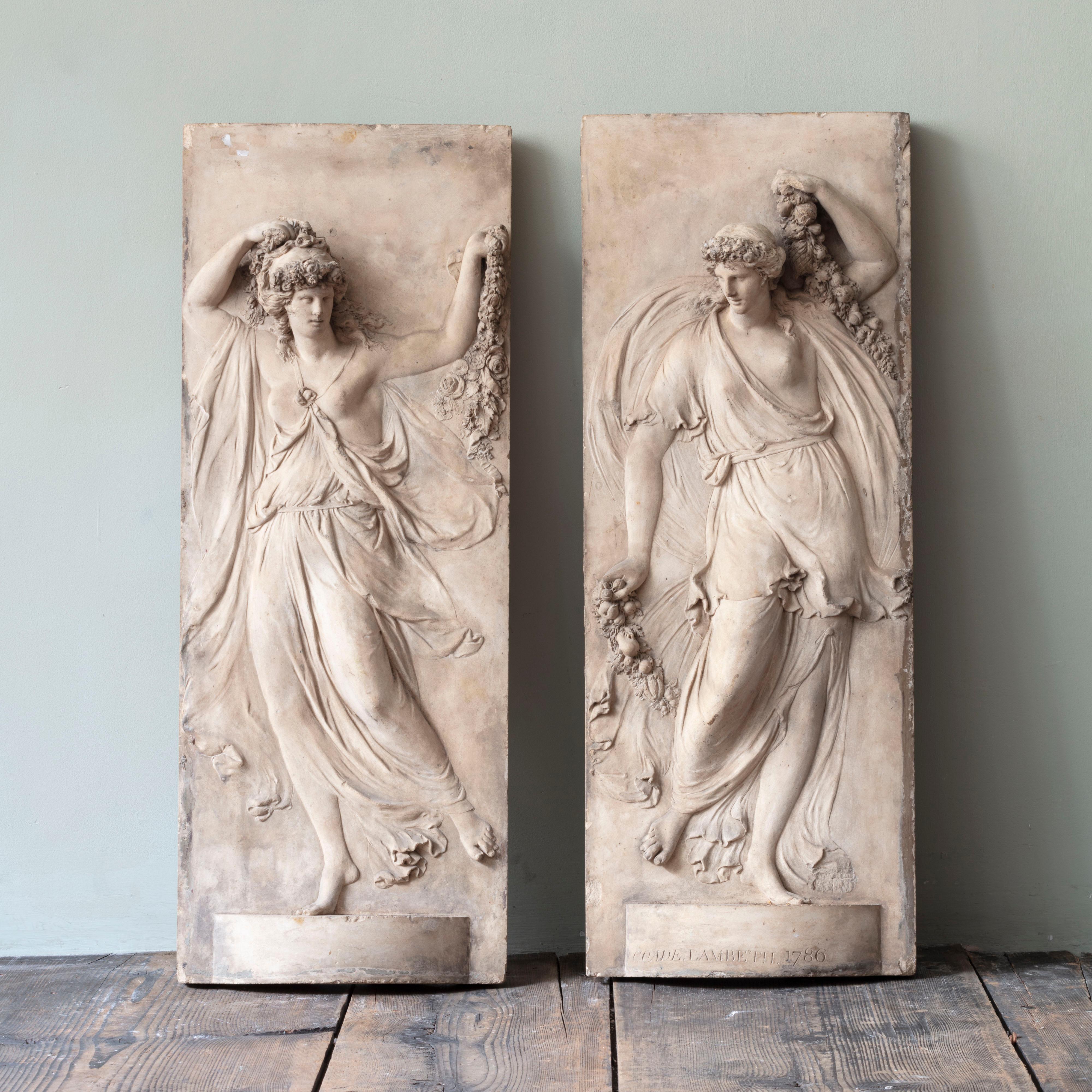A pair of Coade stone figurative panels. Stamped Coade, Lambeth, 1786.