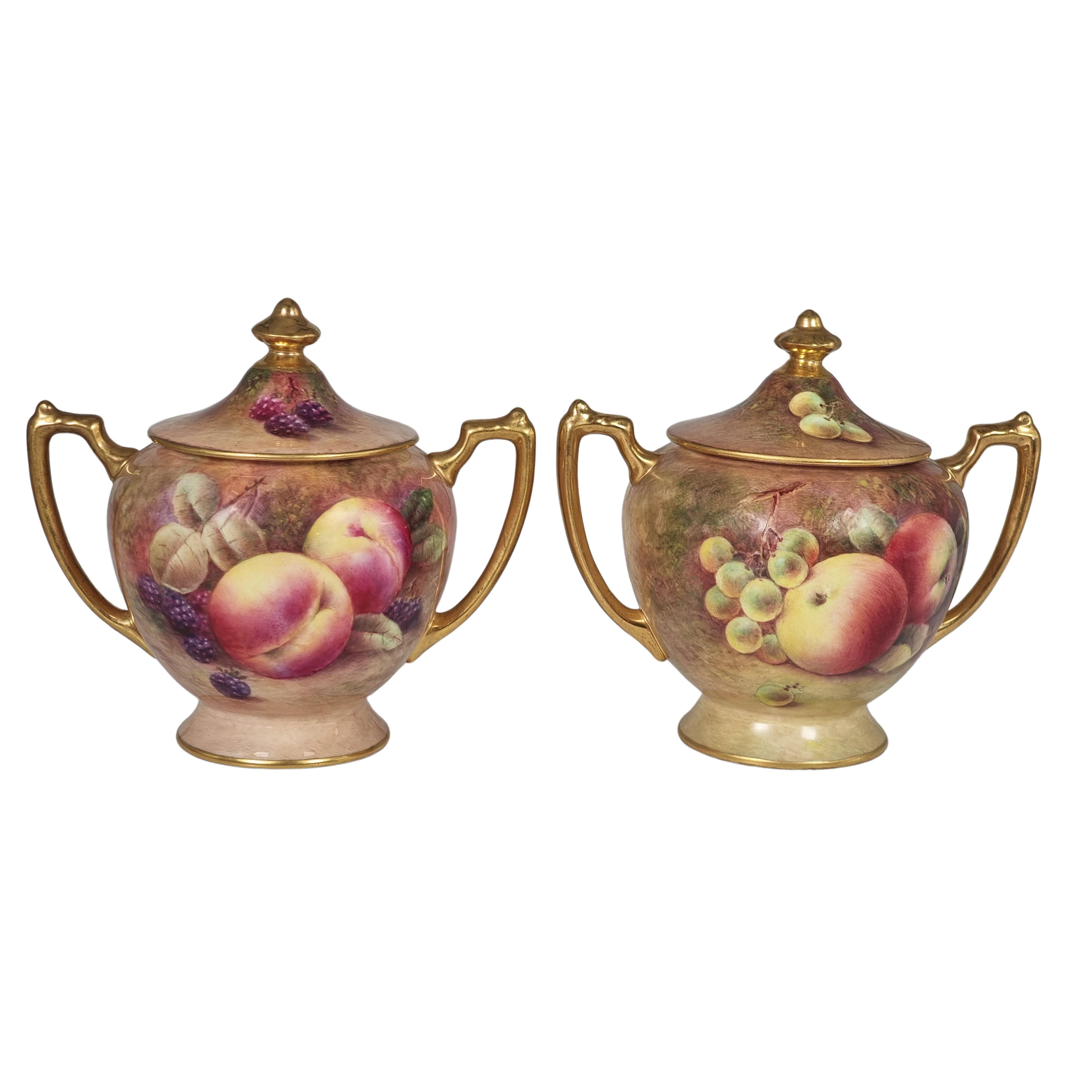 A pair of Coalport vases hand painted with fruit by Richard Budd, English