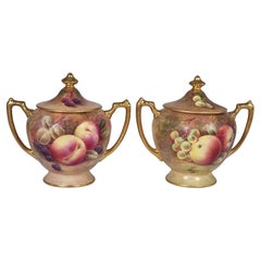 A pair of Coalport vases hand painted with fruit by Richard Budd, English