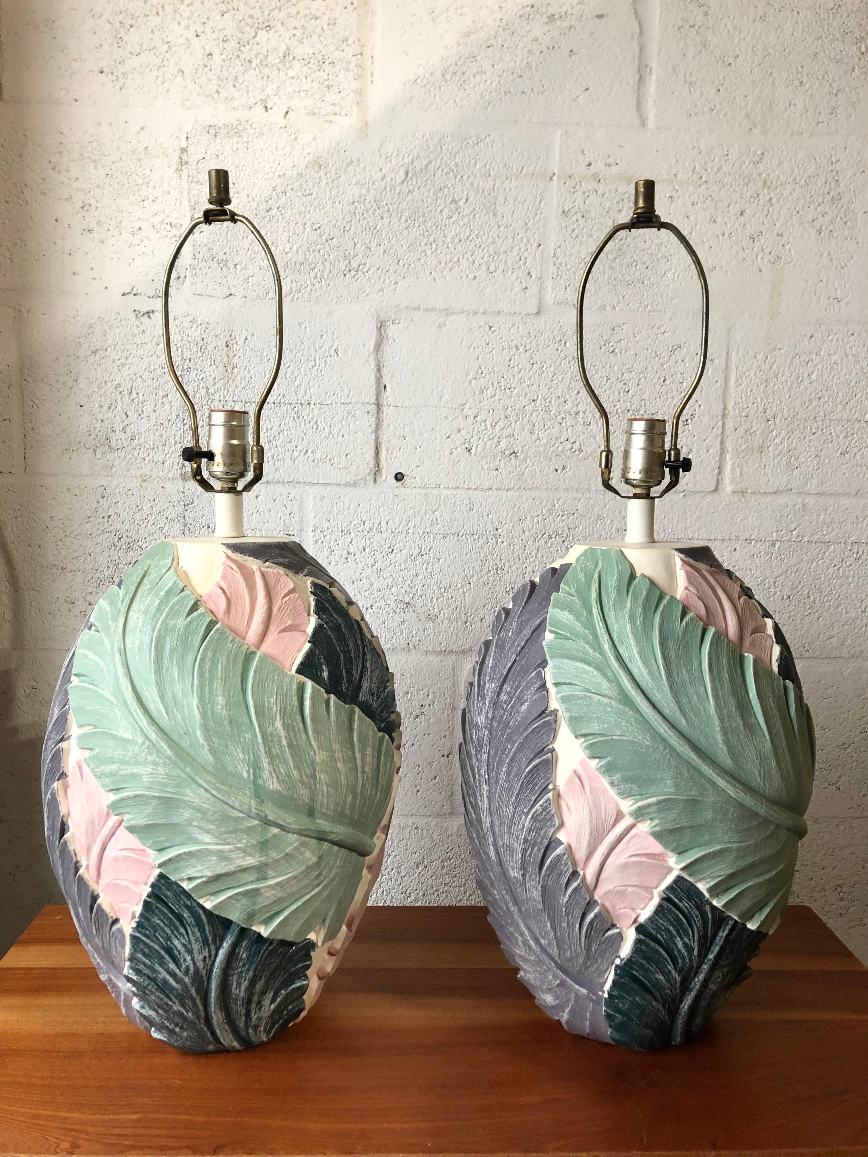 Featuring a pair of late 20th century large scale coastal style carved plaster table lamps. Circa 1980s.
These beautiful Palm Beach Regency/ Hollywood Regency Style Table lamps feature a generous size, and a gorgeous botanical inspired design
