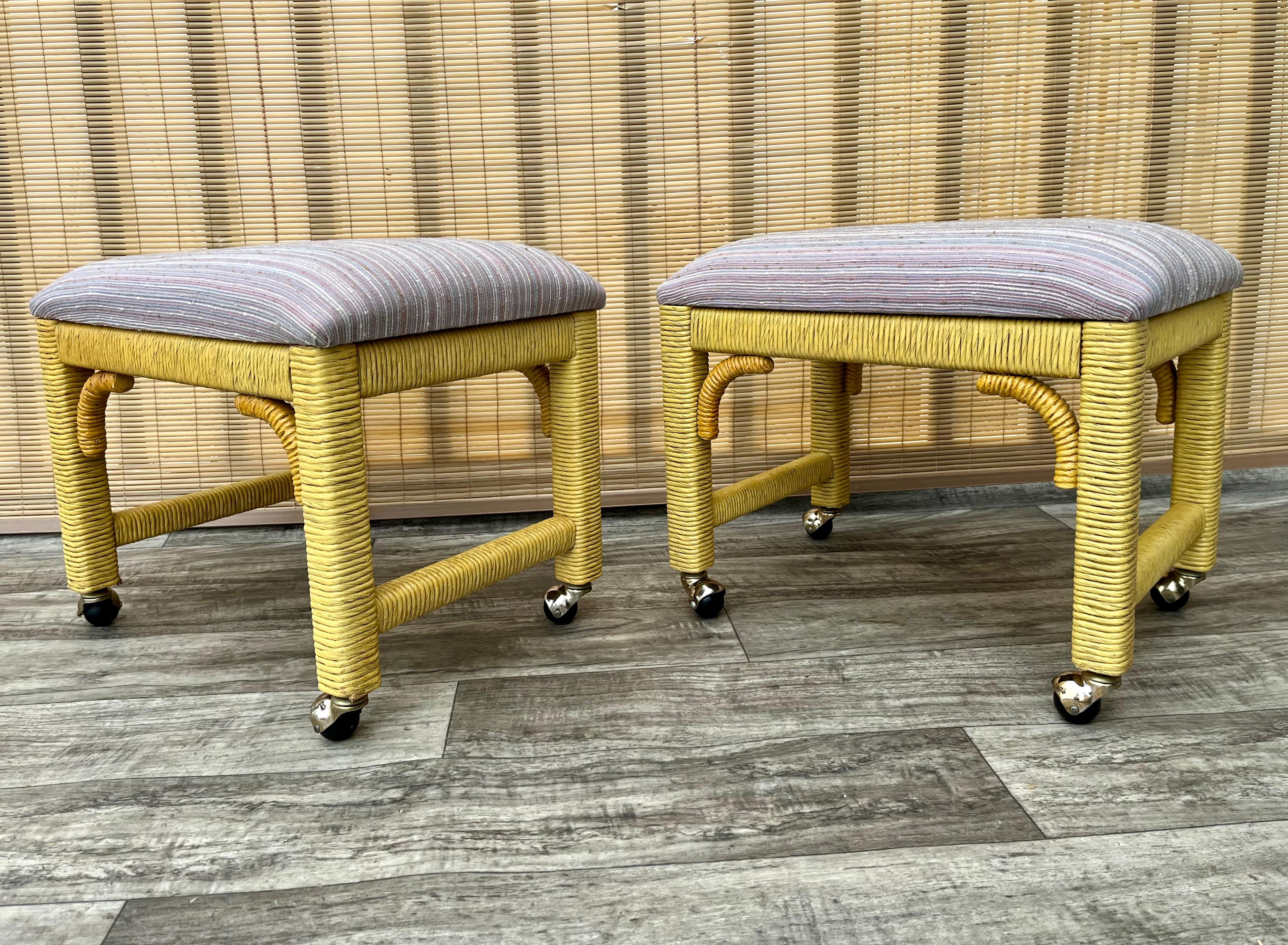 Upholstery A Pair of Coastal Style Rolling Footstools on Casters by Henry Link Furniture. For Sale