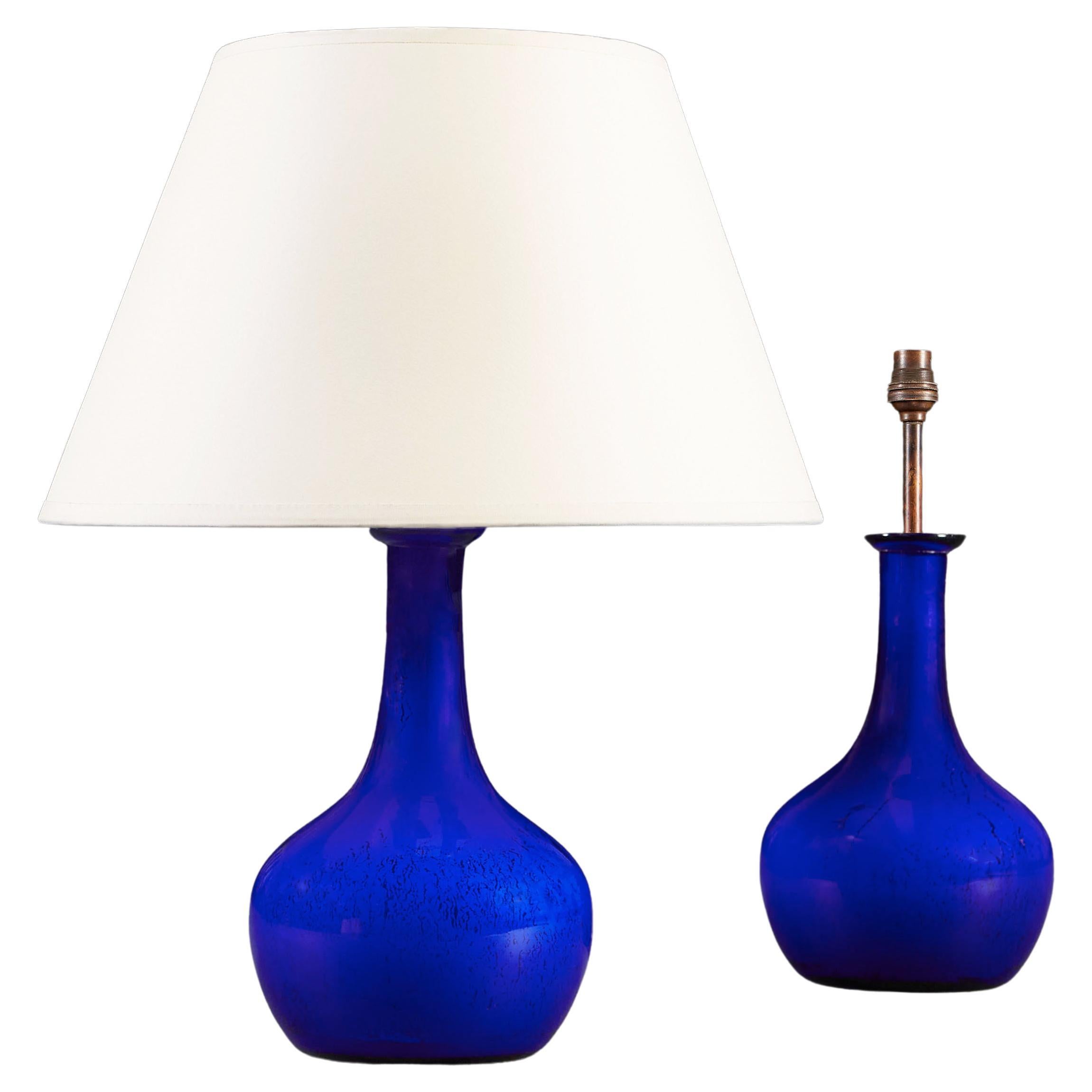 A Pair of Cobalt Blue Glass Bottle Table Lamps