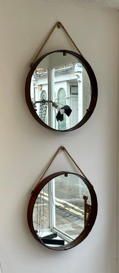 A Pair of Cognac coloured, Leather round Italian Mid 20th Century mirrors