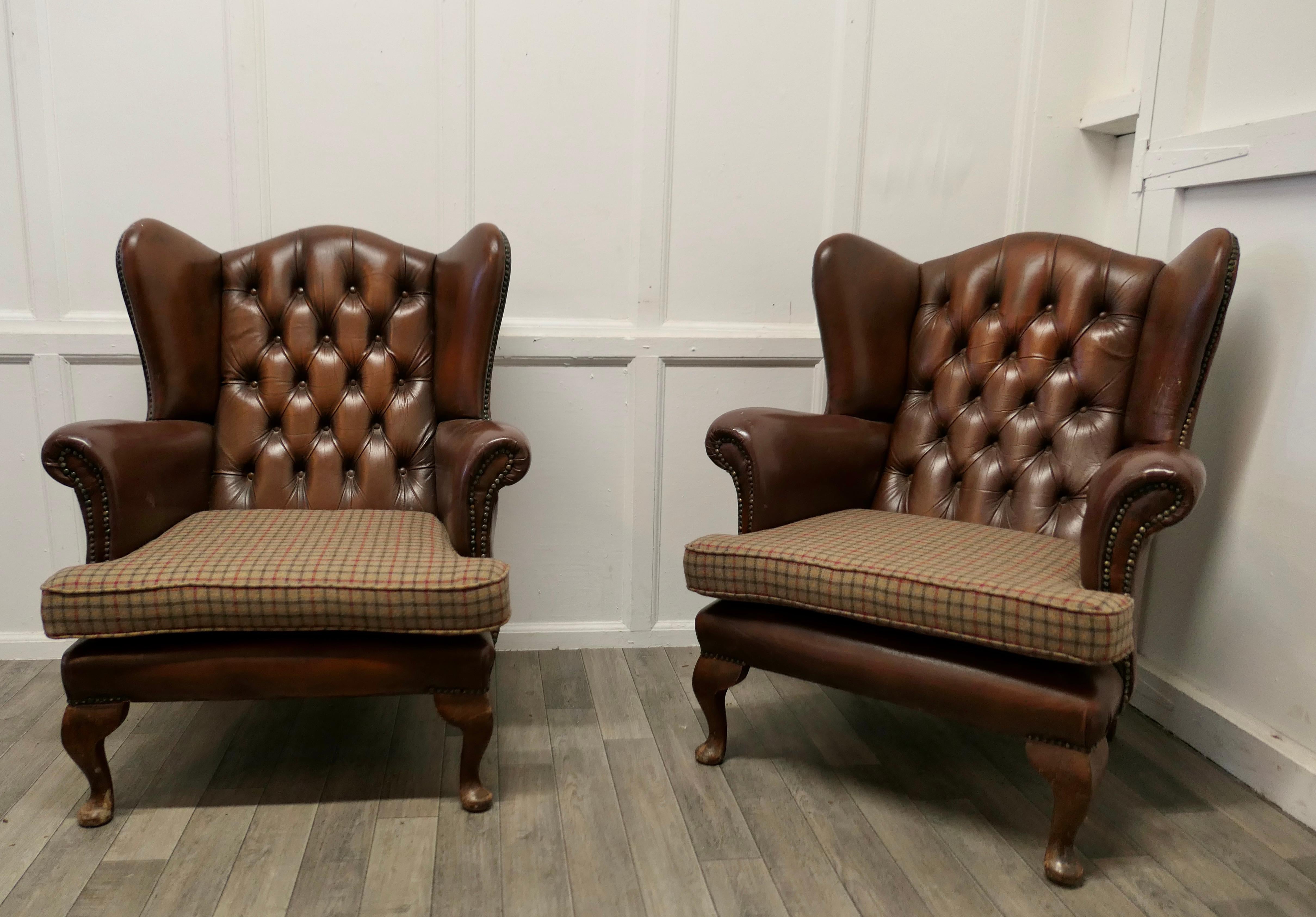 A pair of comfortable wing back leather chesterfield library chairs

These are very roomy chairs, the ultimate in Vintage Country House Chic, the leather upholstery is original with the great character and softness that can only be achieved with