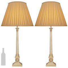 A pair of Continental 19th century Neo-Classical st. Silvered Bronze lamps