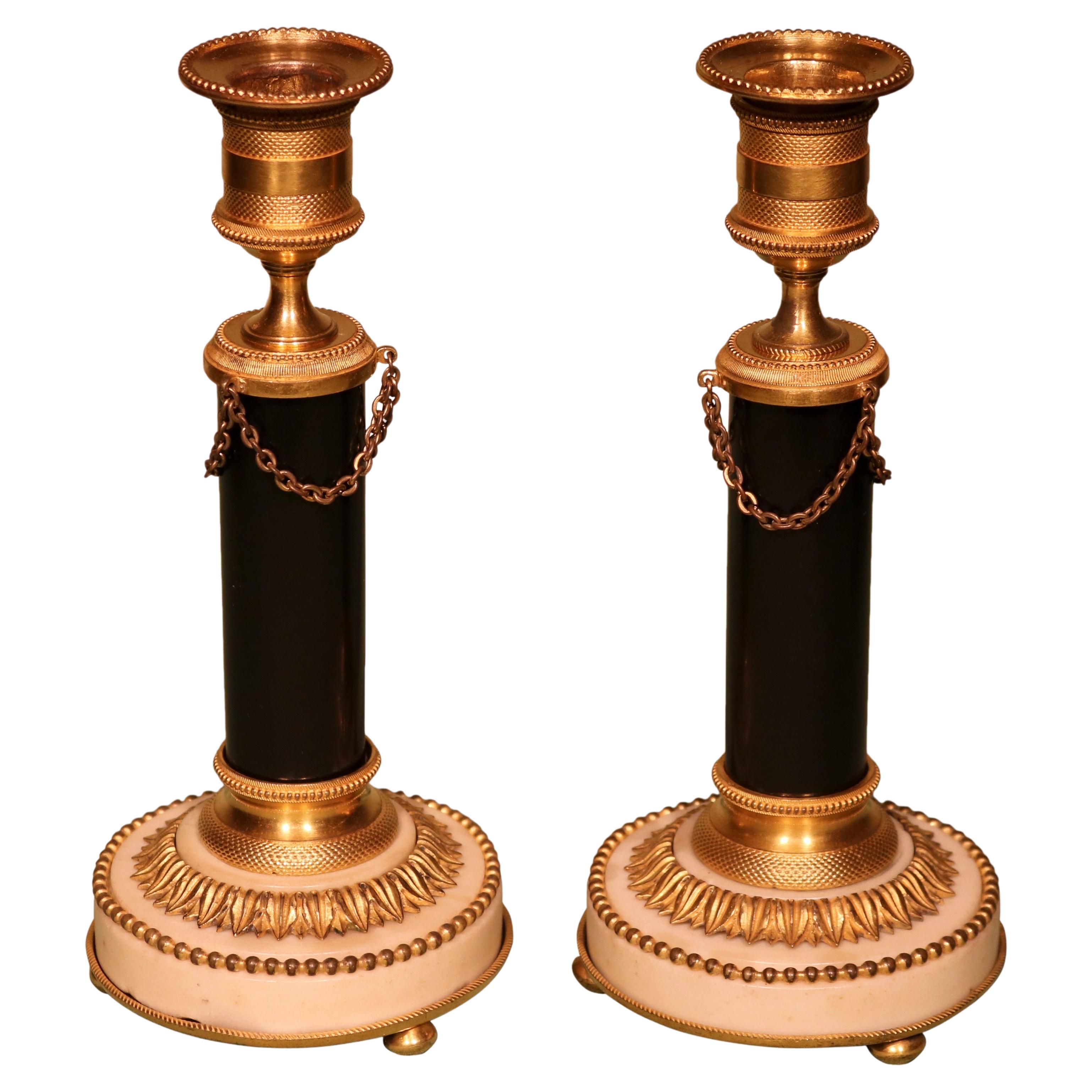 Pair of Continental Bronze and Ormolu and White Marble Candlesticks For Sale