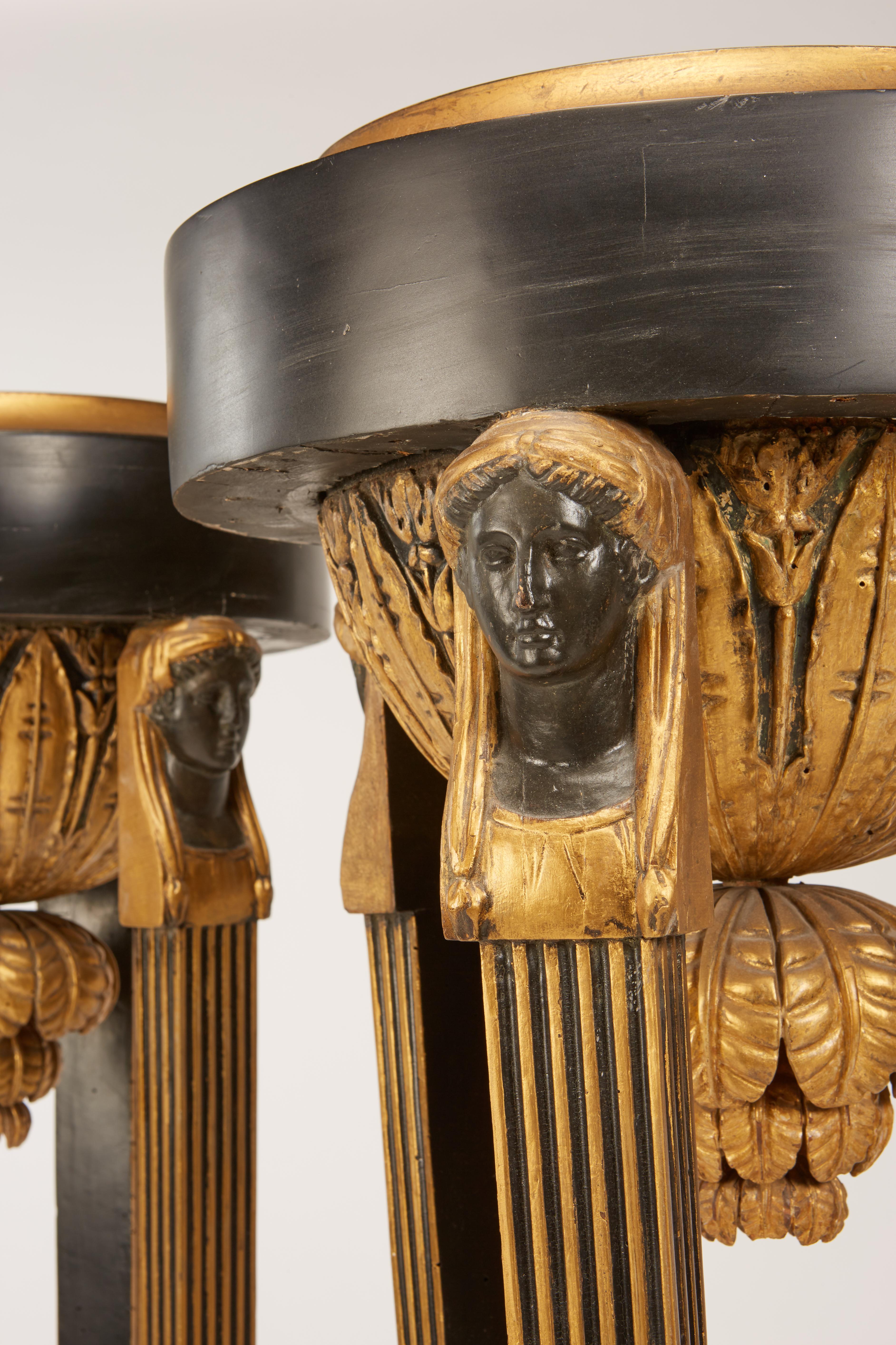 Mid-19th Century Pair of Continental Neoclassic Black Painted and Parcel-gilt Torcheres, Italian For Sale