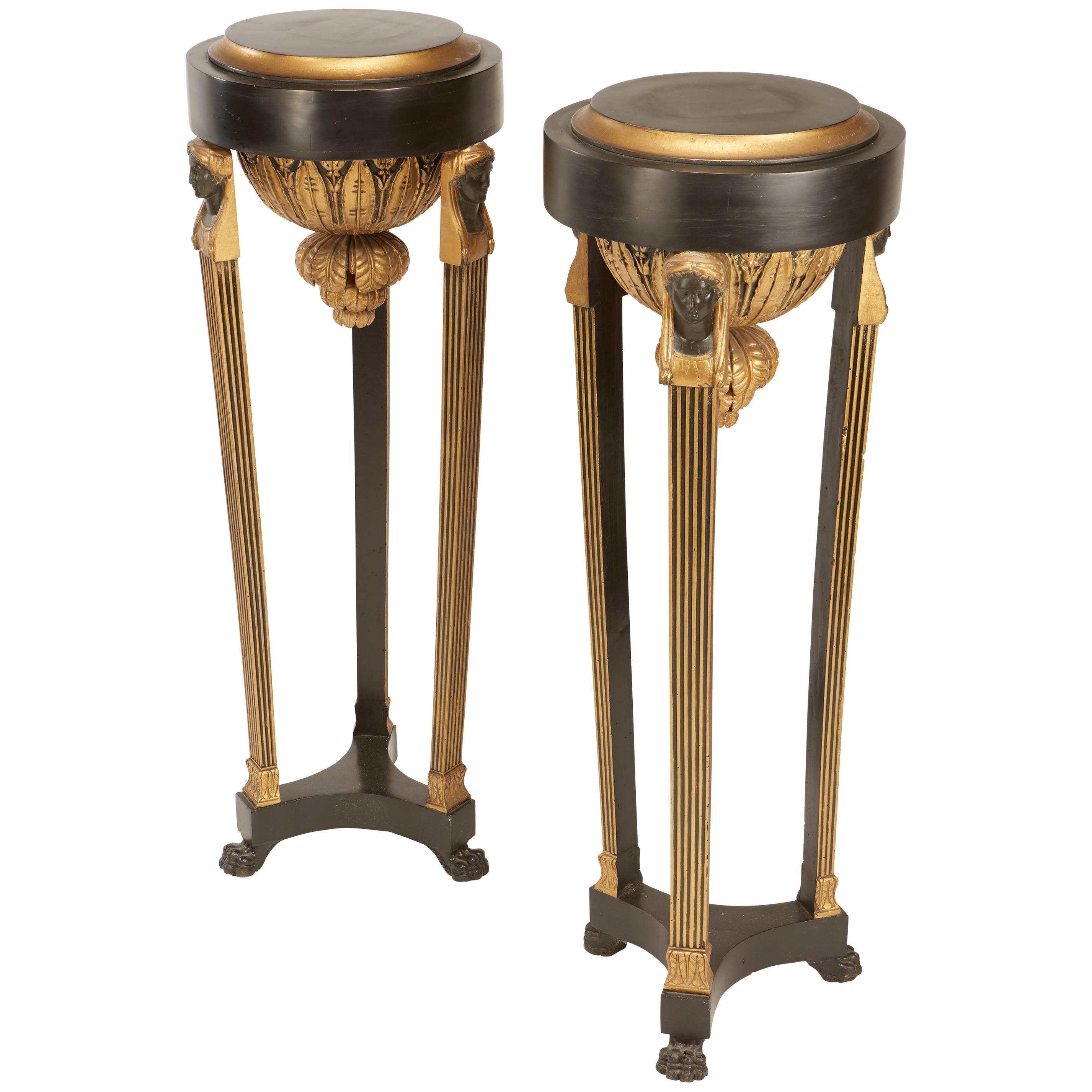 Pair of Continental Neoclassic Black Painted and Parcel-gilt Torcheres, Italian