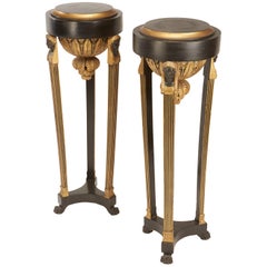 Pair of Continental Neoclassic Black Painted and Parcel-gilt Torcheres, Italian