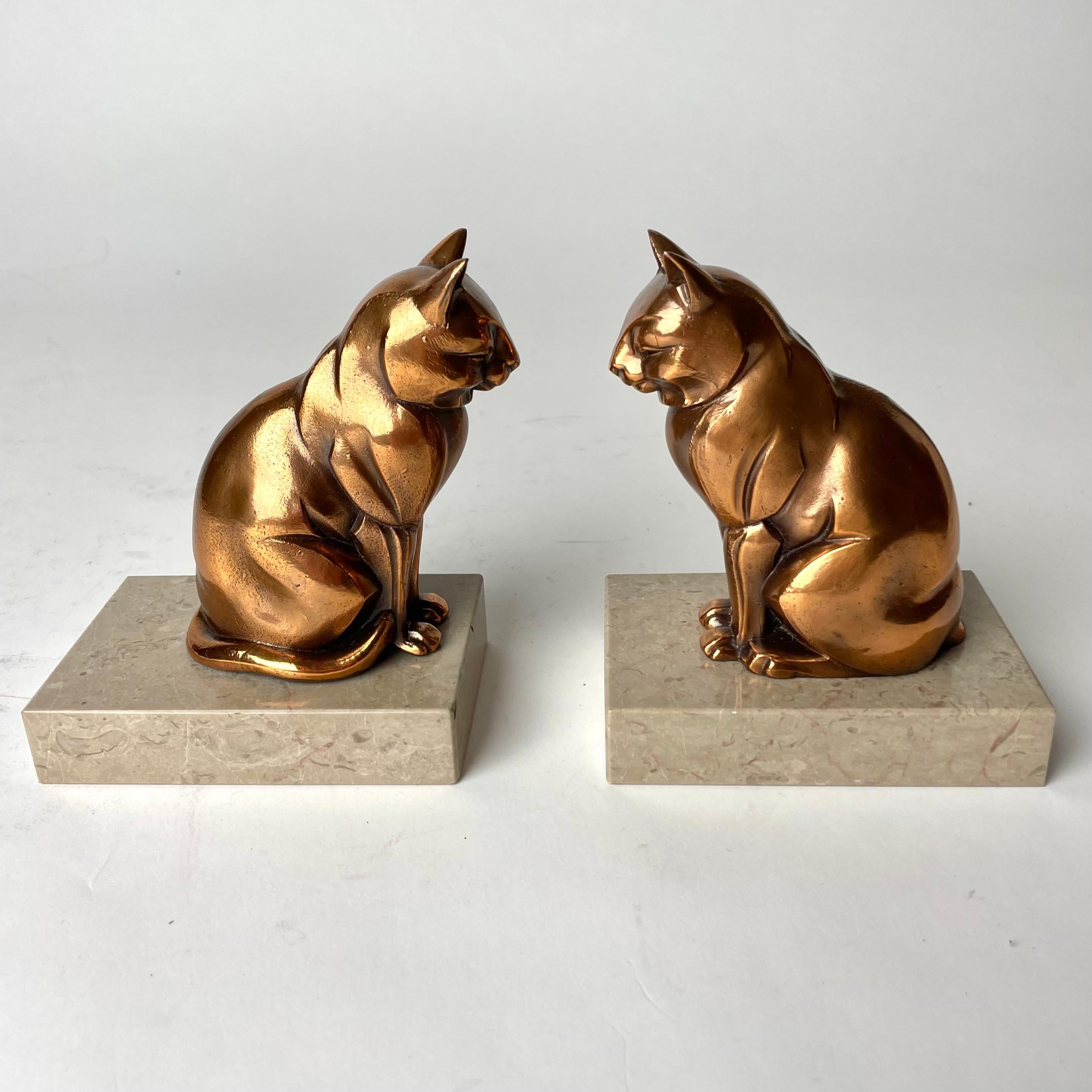 A pair of Cool Art Deco bookends from the 1920s-30s. Very period Art Deco cats in metal and marble.


Wear consistent with age and use 