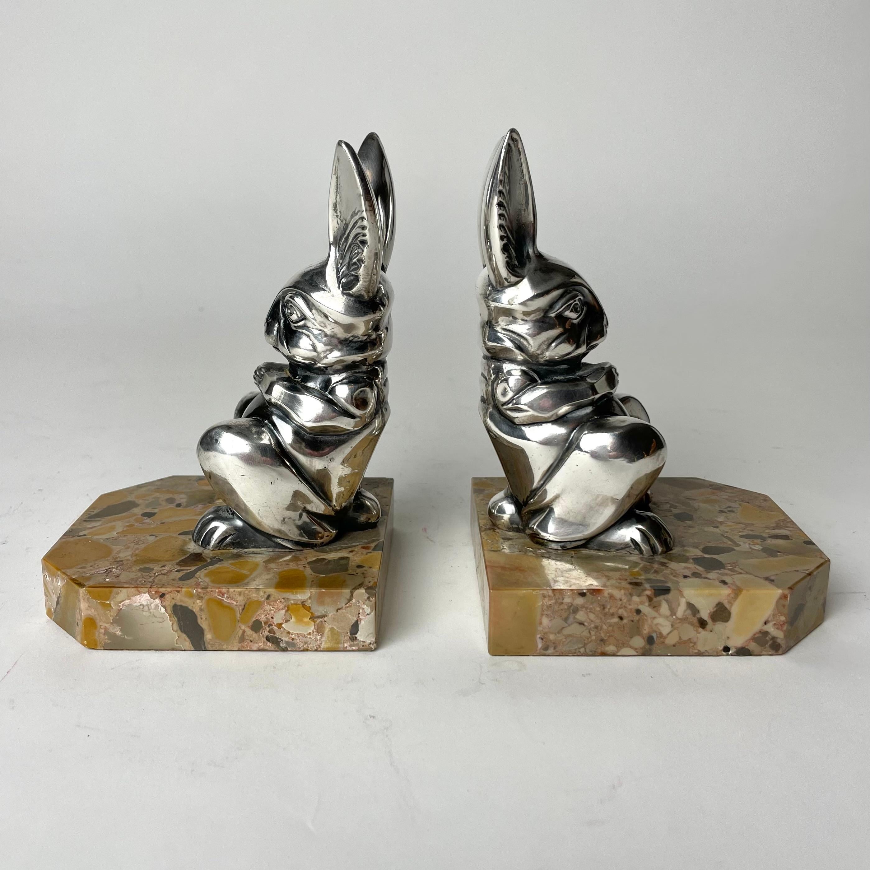 A pair of Cool Art Deco bookends from the 1920s by the French designer Hippolyte Moreau (1832-1926). Very period Art Deco design in silver-plated metal and marble.


Wear consistent with age and use 