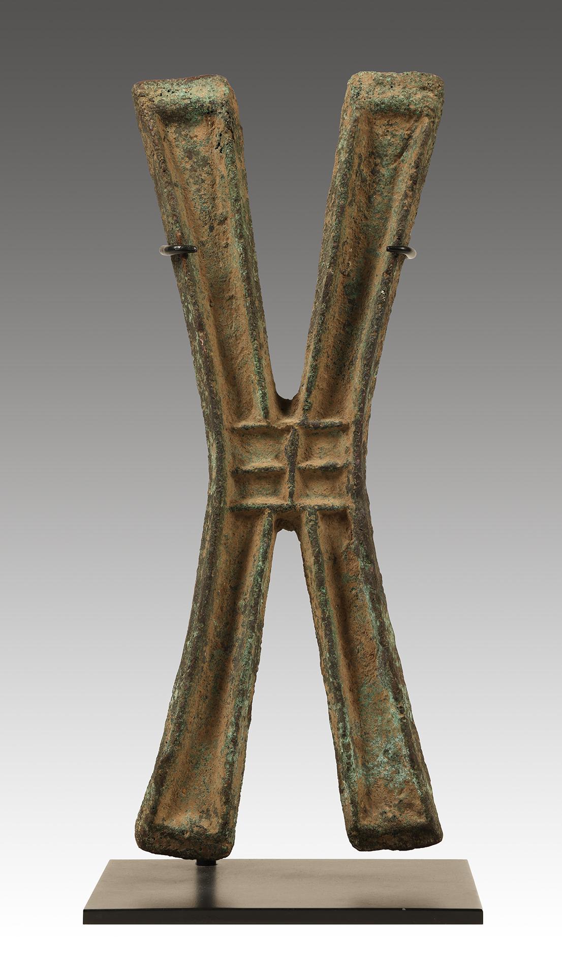 
A Pair of Copper Currencies: “Katanga Crosses”
Central African Copper Belt (DR Congo, Zambia or Zimbabwe)
Cast copper, archaeological patina
Size each: 12” high x 5” wide x 1/2” deep (30.5 x 12.5 x 1.5 cm)

Displayed on custom-made metal bases, as