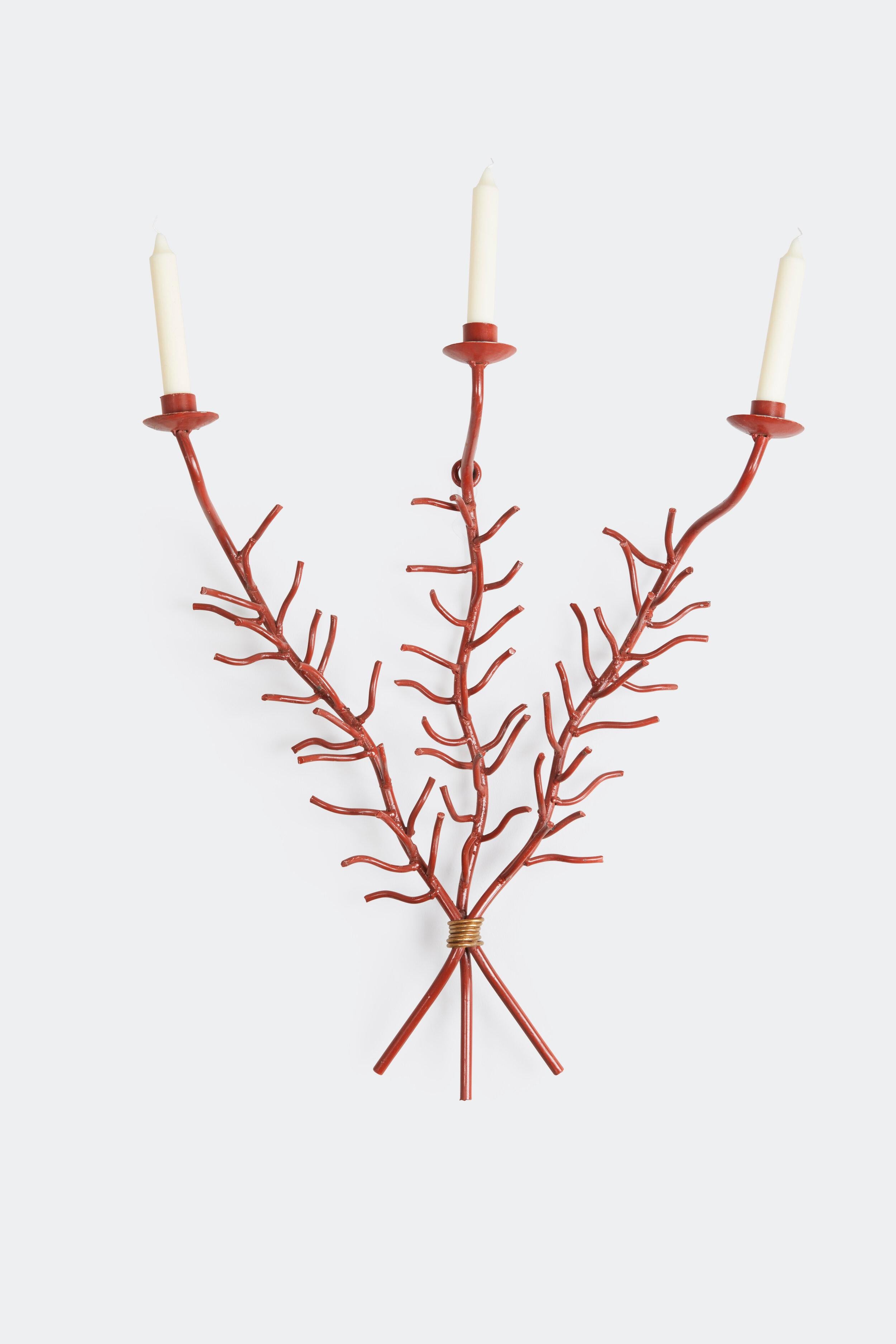 A pair of 20th century red painted iron sconces, each composed of three coral form branches bound by brass wire topped by candle cups. Provenance: de Kwiatkowski estate, designed by Parish-Hadley.