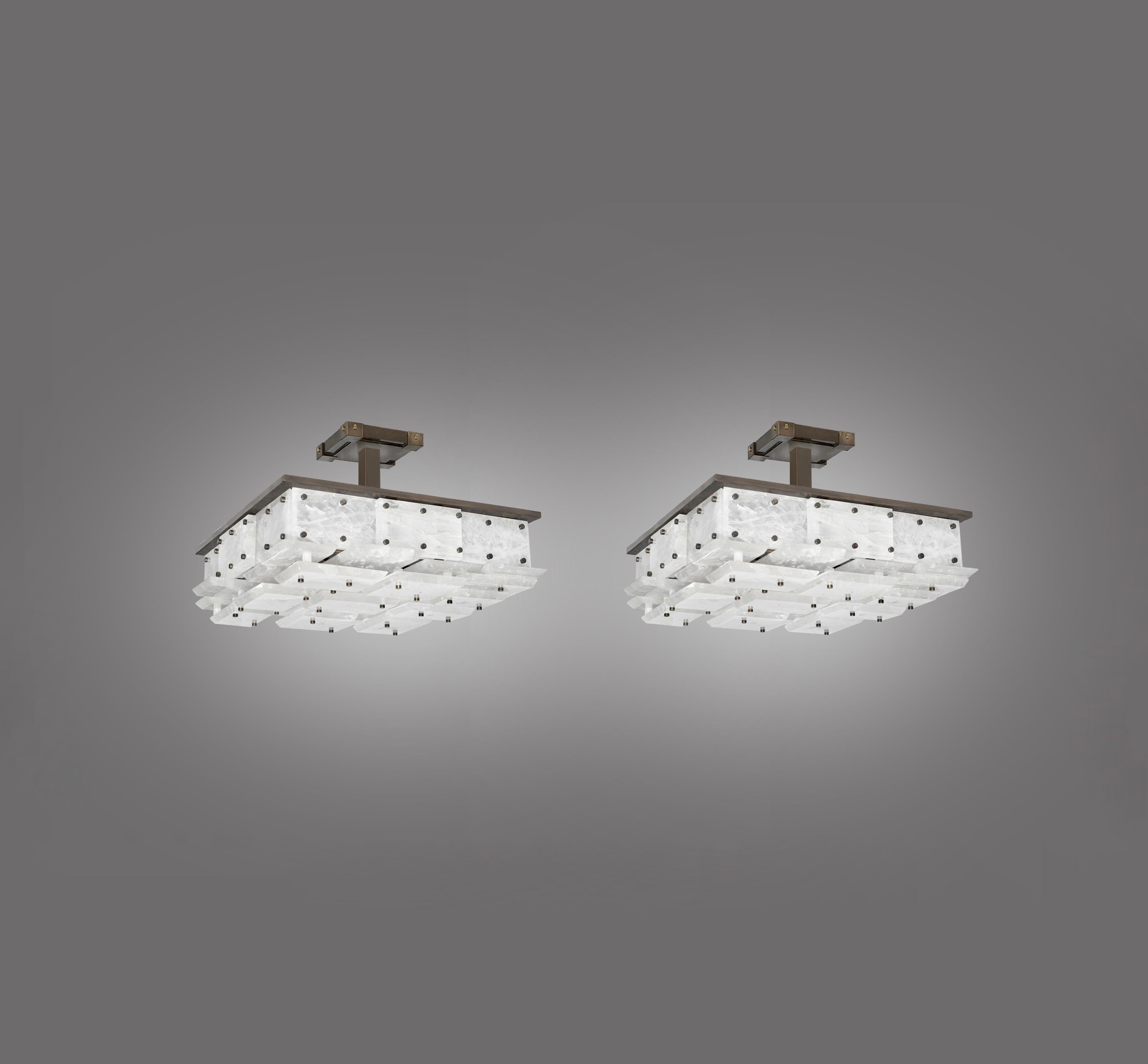 Pair of modern rock crystal semi flush mounts with multiple panels decorations, antique brass mount. Created by Phoenix Gallery NYC.
  