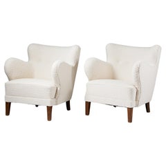 Used A pair of cream bouclé easy chairs, anonymous, Denmark, 1940s