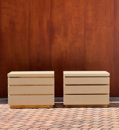A pair of cream lacquered nightstands by Jean Claude Mahey, signed, circa 1980