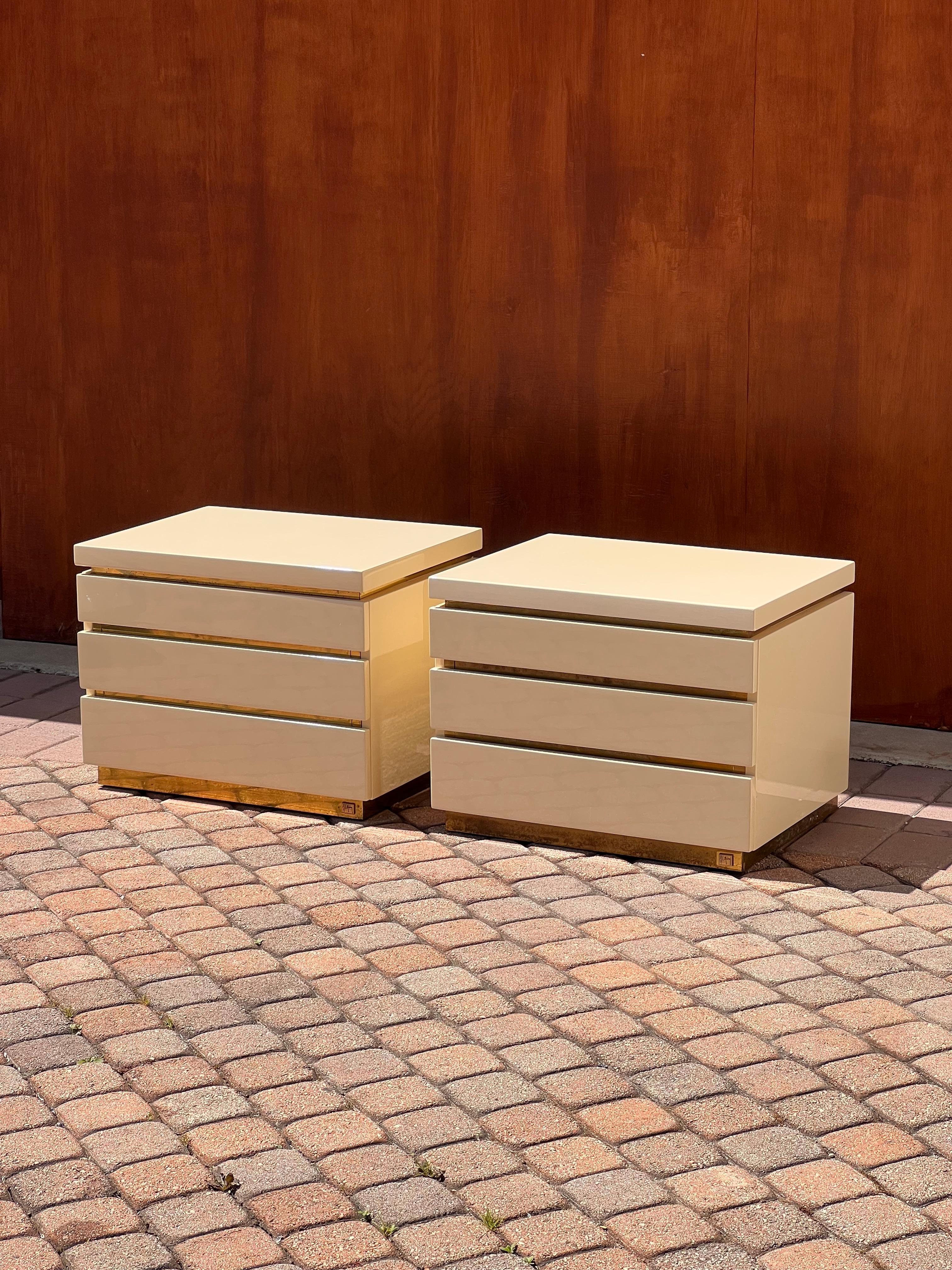 Hollywood Regency A pair of cream lacquered nightstands by Jean Claude Mahey, signed, circa 1980 For Sale
