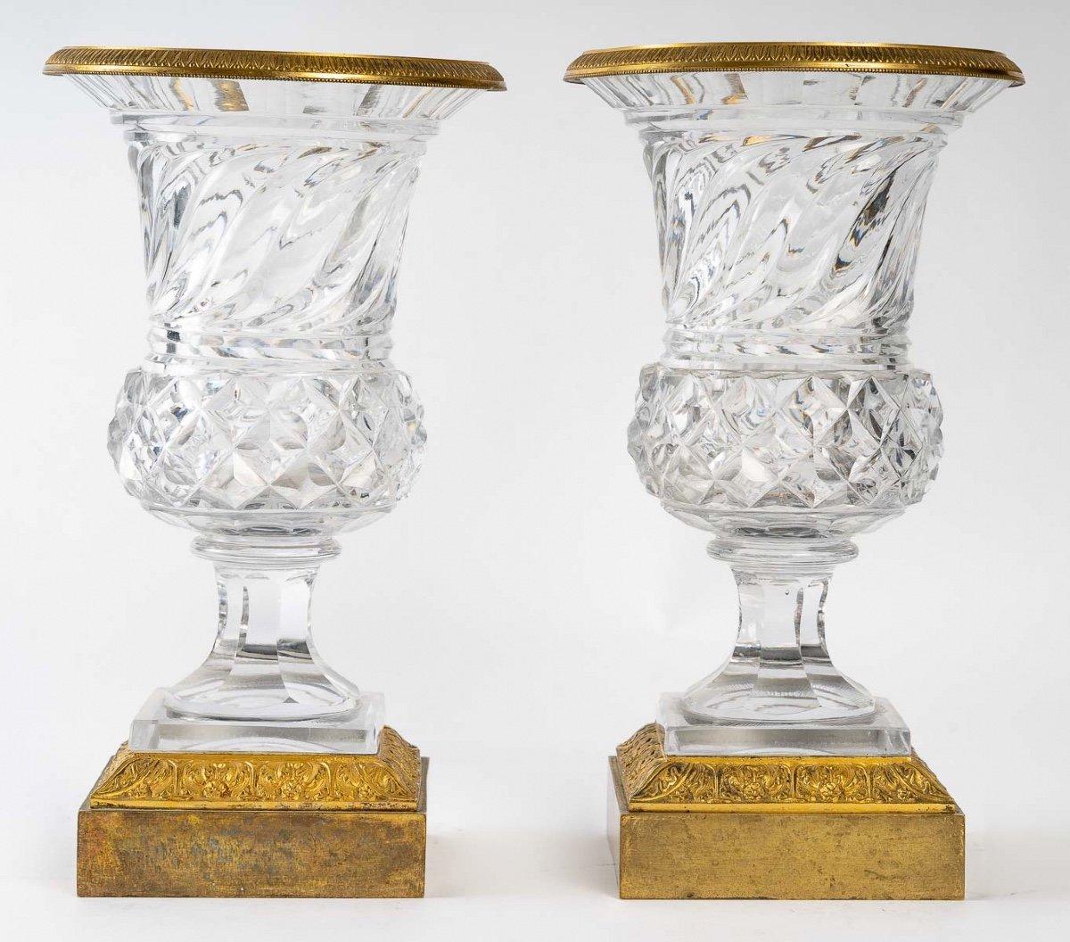 A pair of crystal and gilt bronze vases, Napoleon III period, late 19th century.
Measures: Width : 17 cm
Diameter : 12 cm
Height : 30 cm.