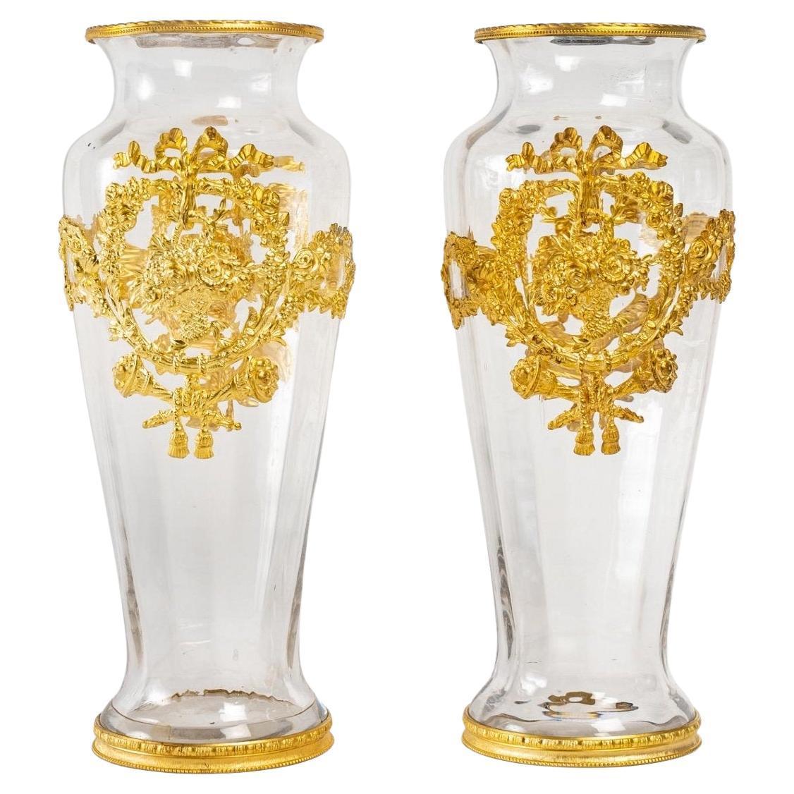 A pair of crystal and gilt bronze vases, Napoleon III period, 19th century.
In perfect condition.
Measures: H: 26 cm, D: 11 cm.
 