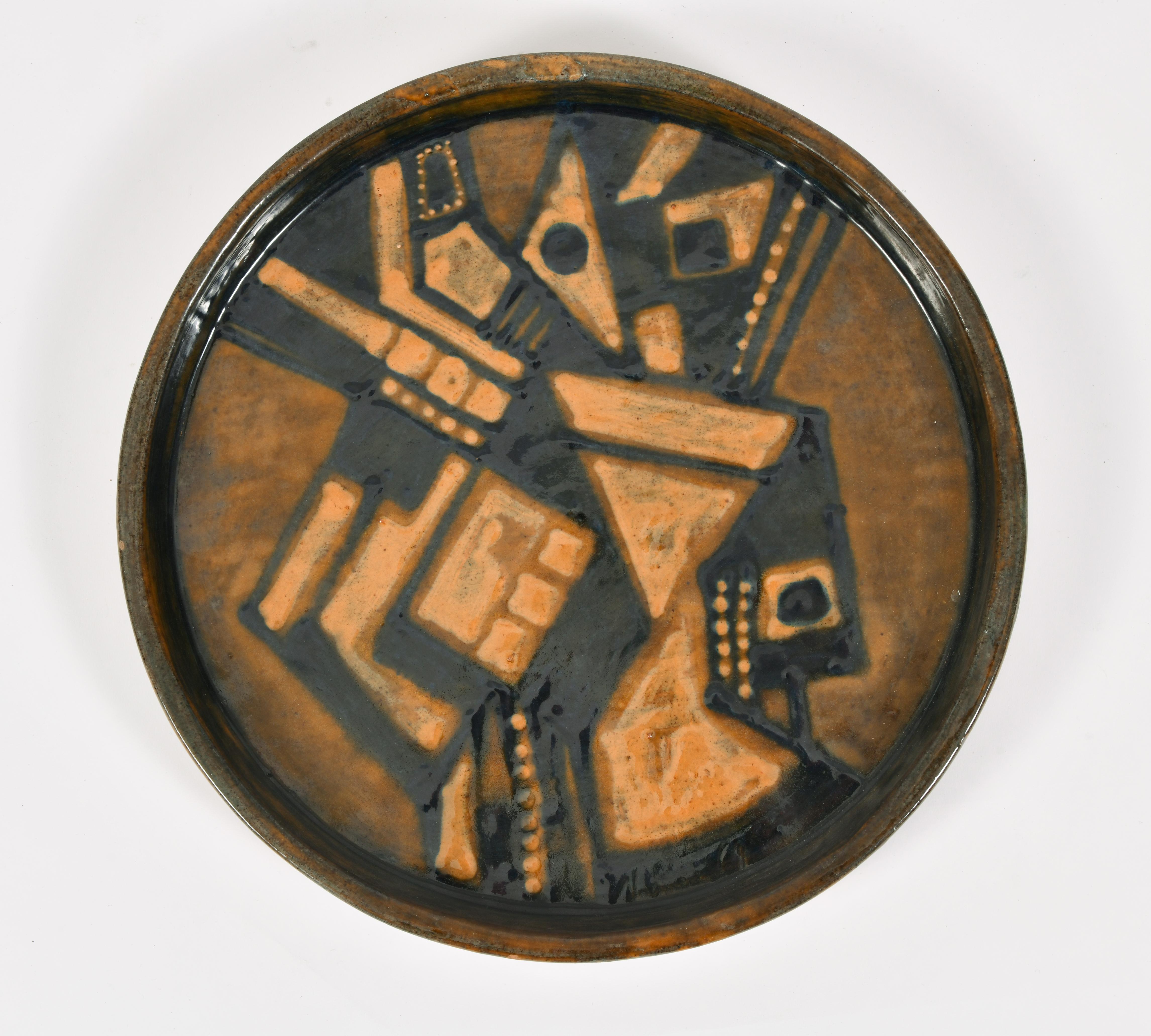 A pair of large Cubist polychrome ceramic wall plates
Both signed Noguera and dated 1969 and 1971.