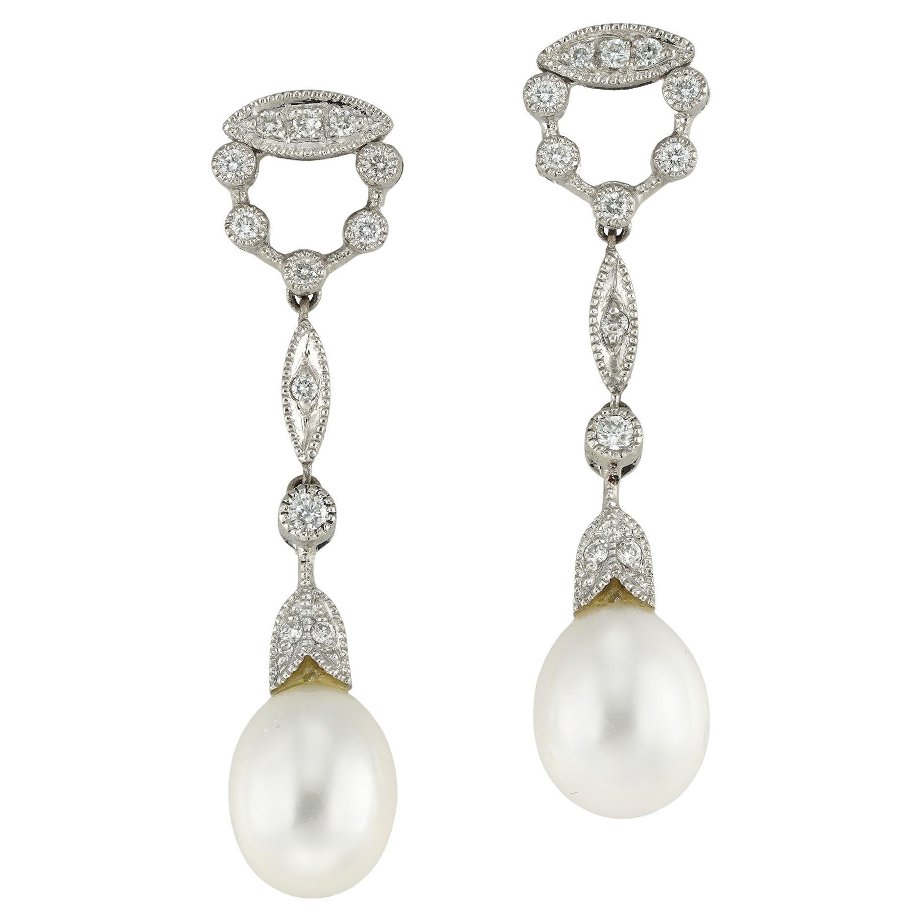 A pair of cultured pearl and diamond drop earrings For Sale