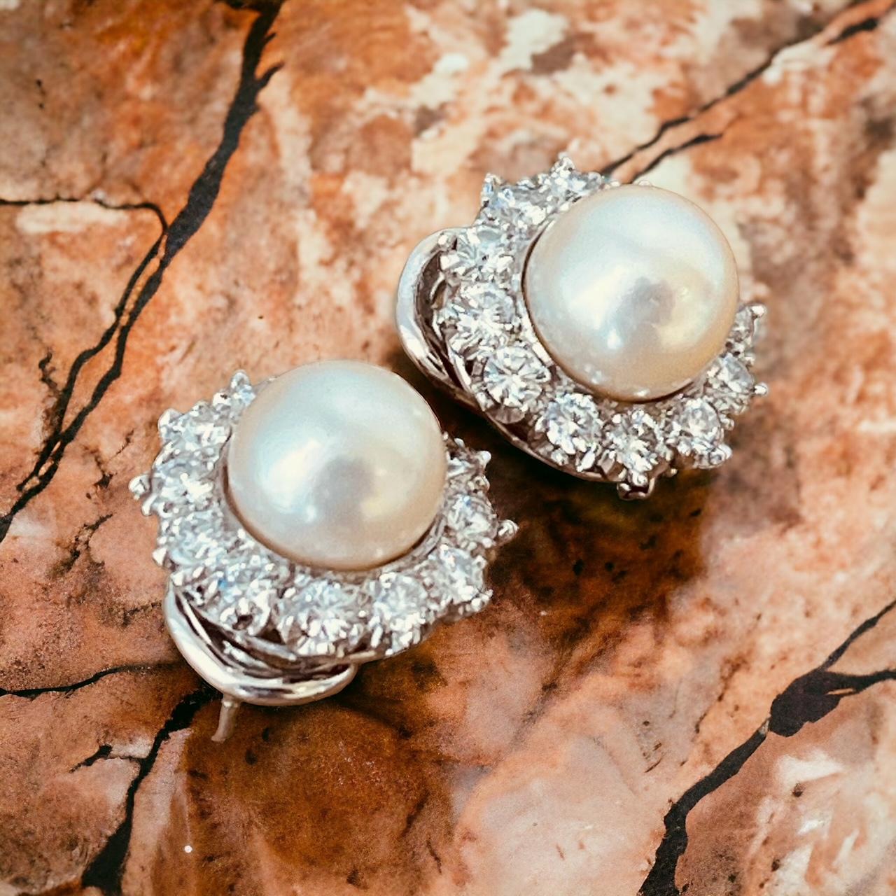 A Pair of Cultured Pearl and Diamond Earclips Mounted in Platinum. Circa 1970's  For Sale 9