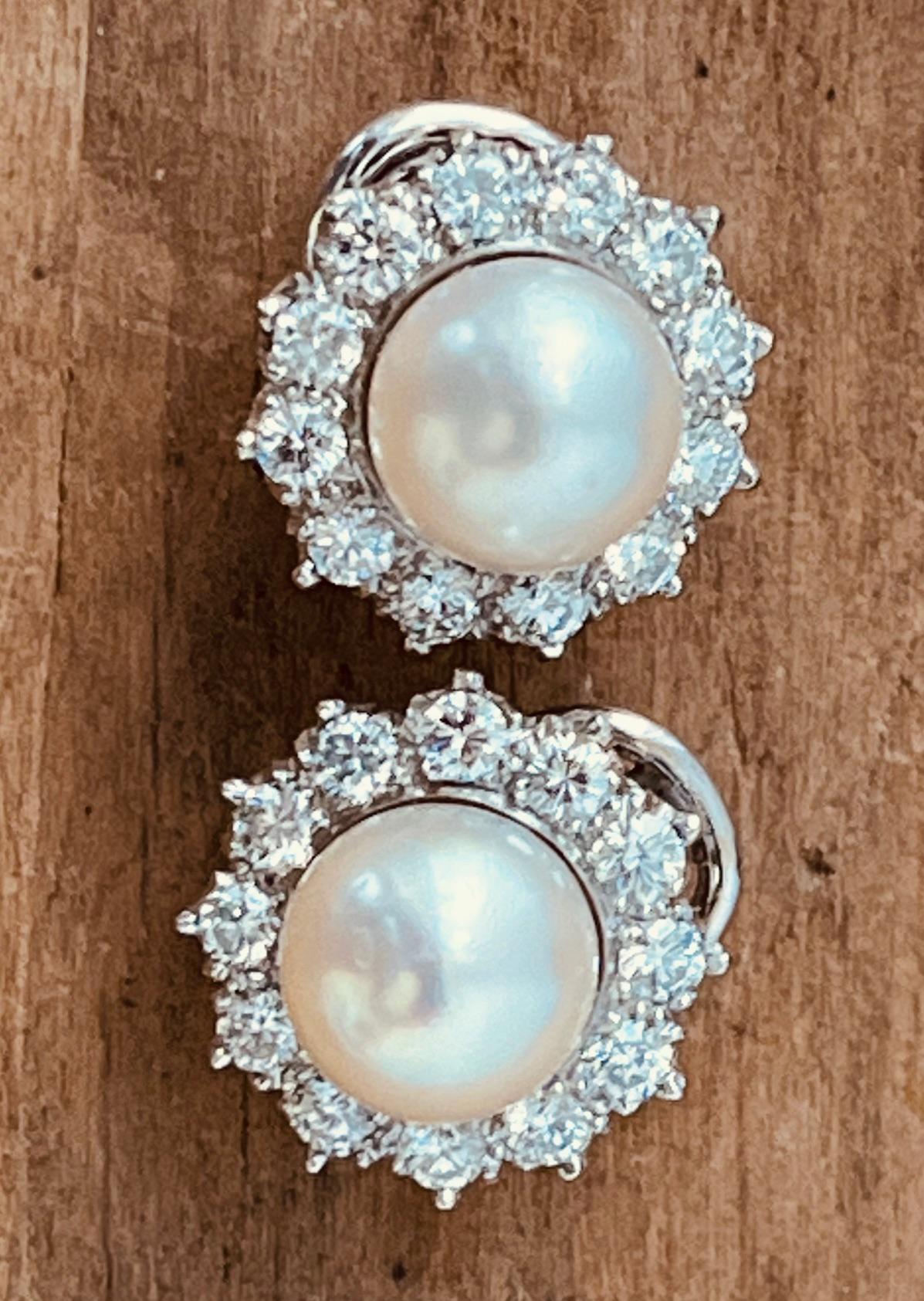 Brilliant Cut A Pair of Cultured Pearl and Diamond Earclips Mounted in Platinum. Circa 1970's  For Sale