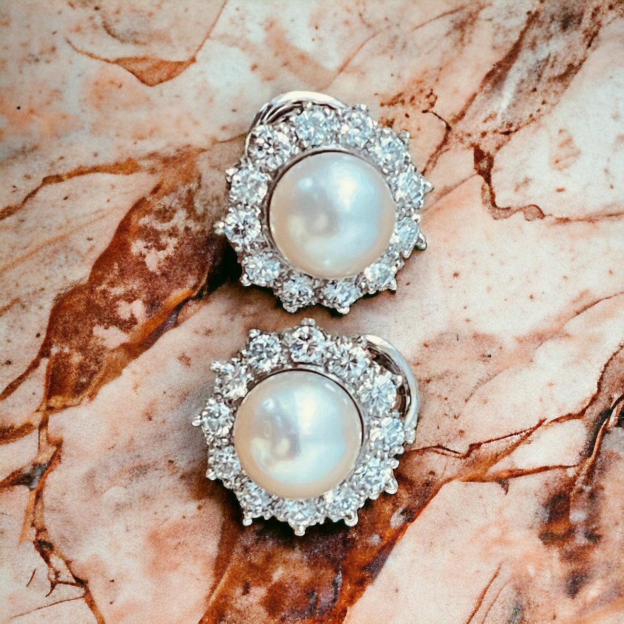 Women's A Pair of Cultured Pearl and Diamond Earclips Mounted in Platinum. Circa 1970's  For Sale