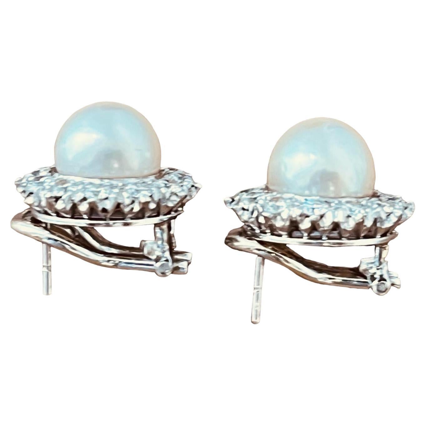 A Pair of Cultured Pearl and Diamond Earclips Mounted in Platinum. Circa 1970's 