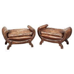 A Pair of Curved and Studded Leather Seats